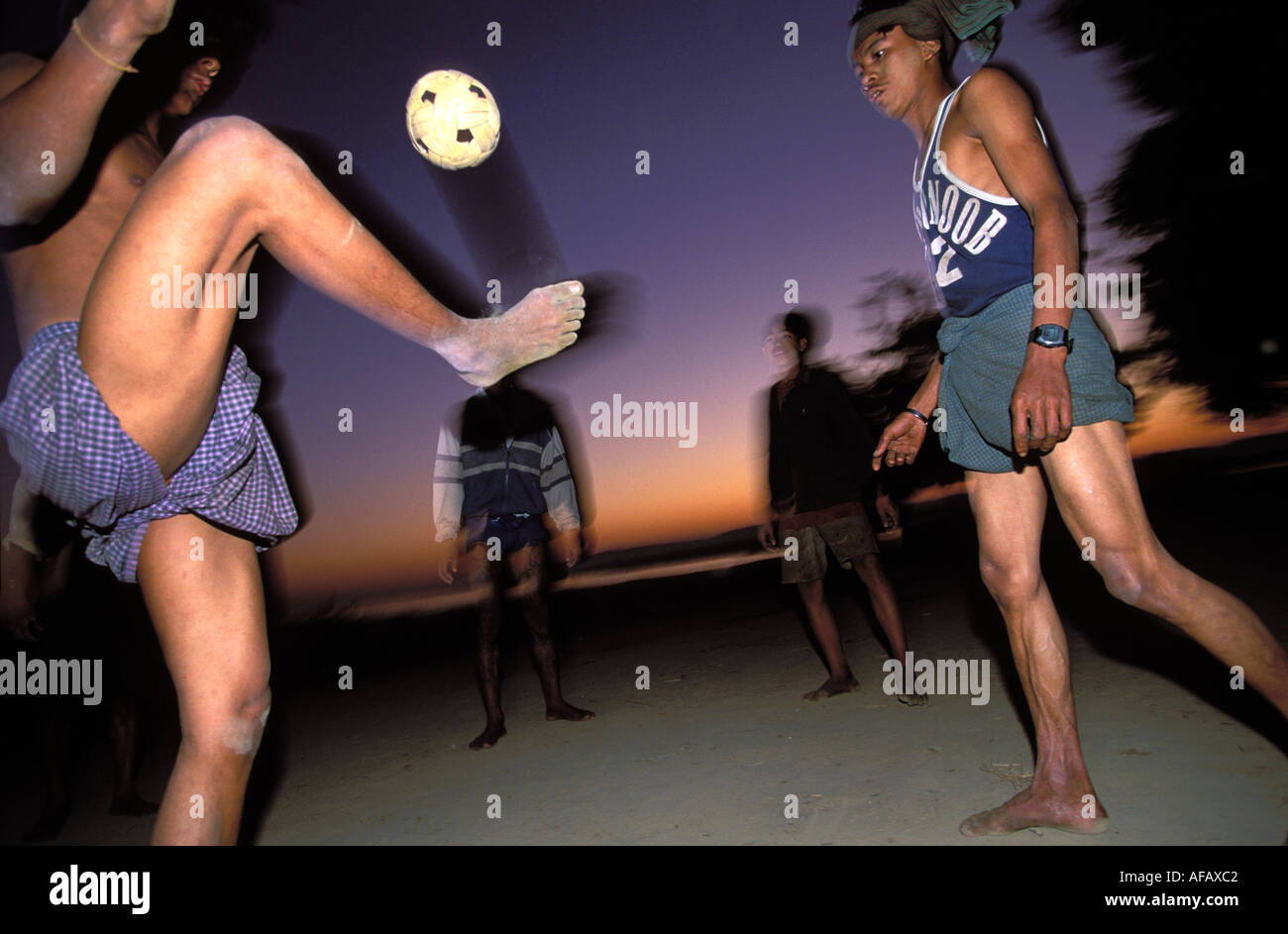 Mandalay guys playing the national game Chinlon keeping a rattan ball in the air by foot Stock Photo