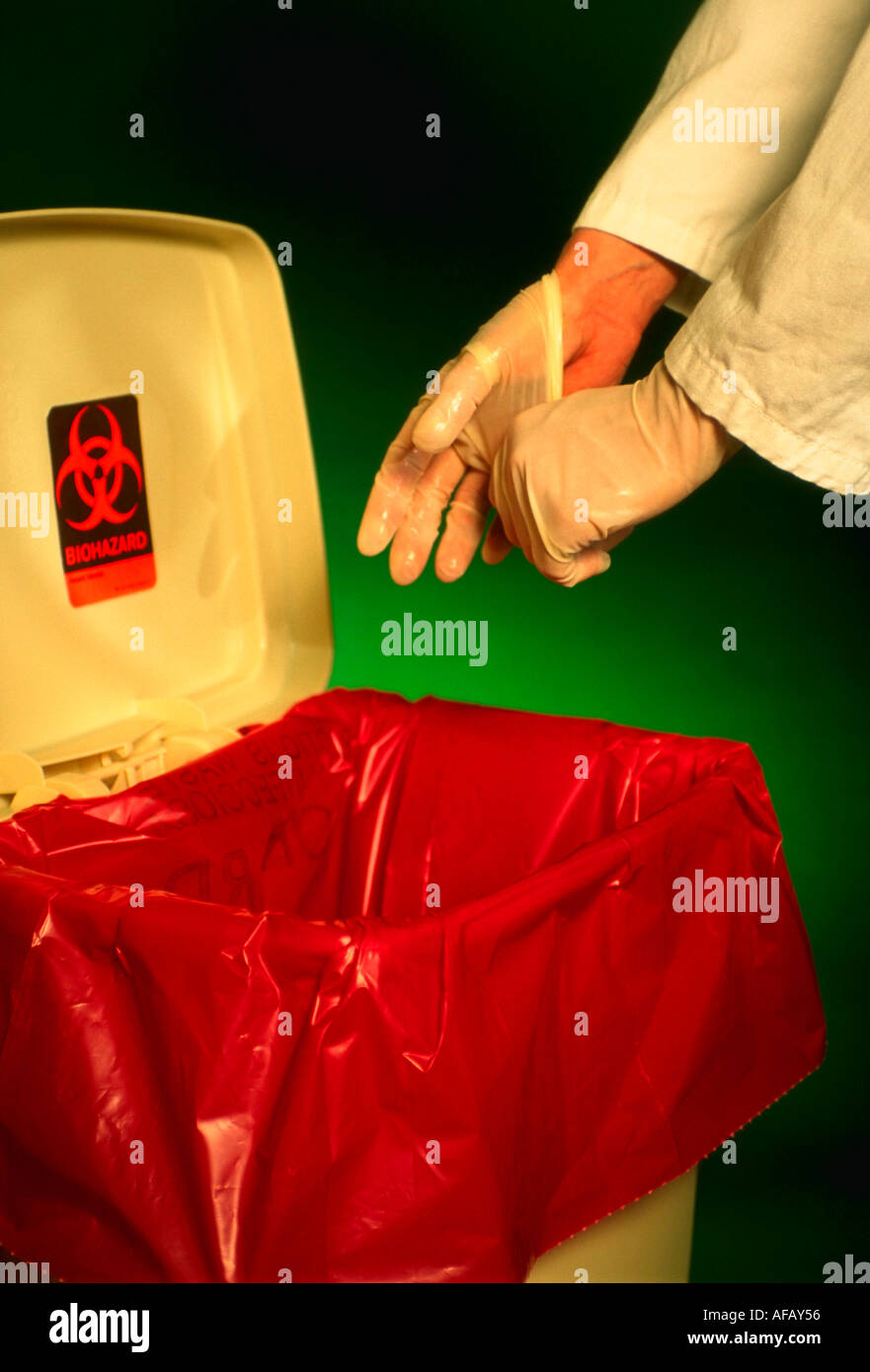 Latex gloves being disposed of into biohazardous waste container MR