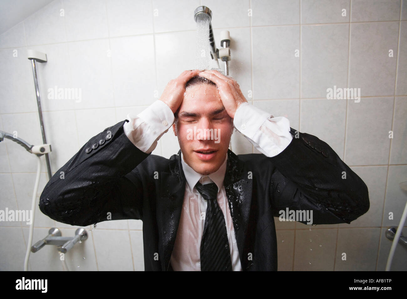 Businessman under shower Stock Photo