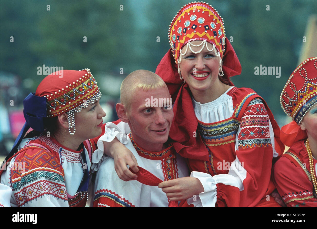 Portrait of man and women in Russian native raiment. El-Oiyn - national festival of Altaic people. Russia Stock Photo