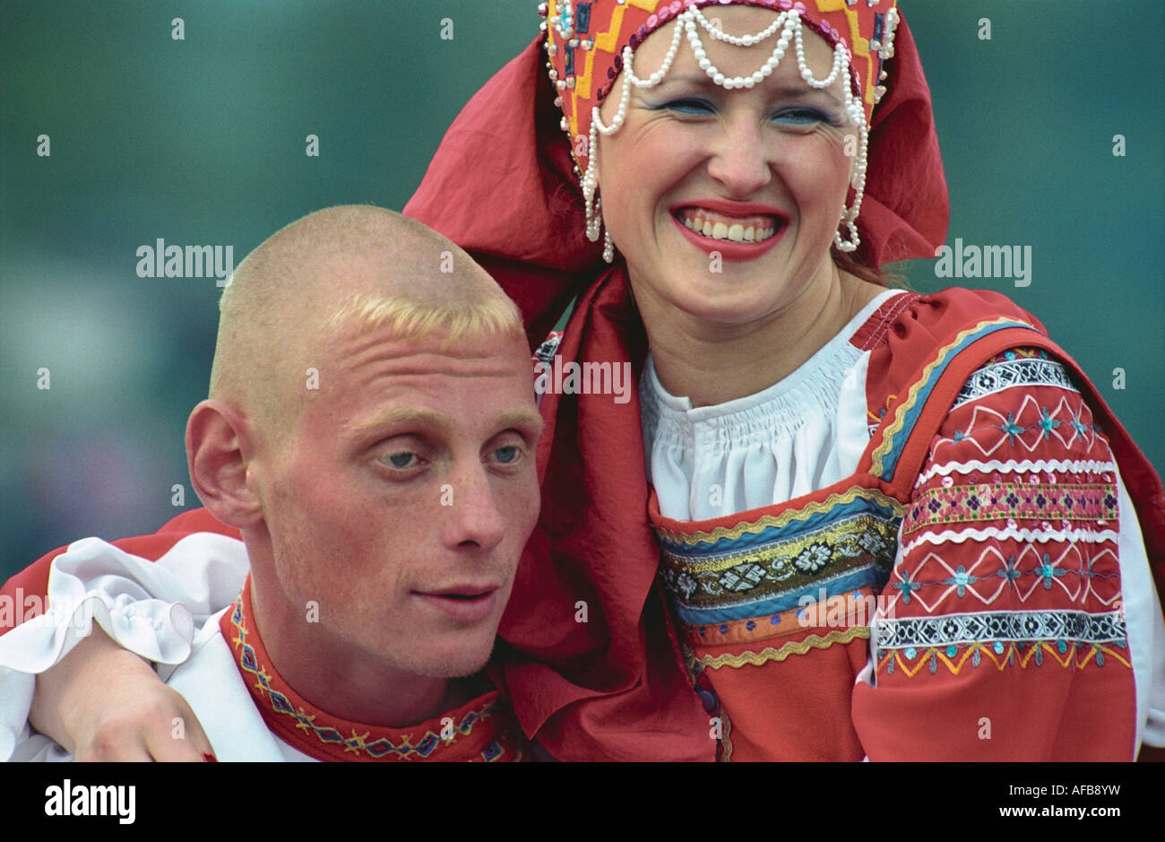 Portrait of man and woman in Russian native raiment. El-Oiyn - national festival of Altaic people. Russia Stock Photo