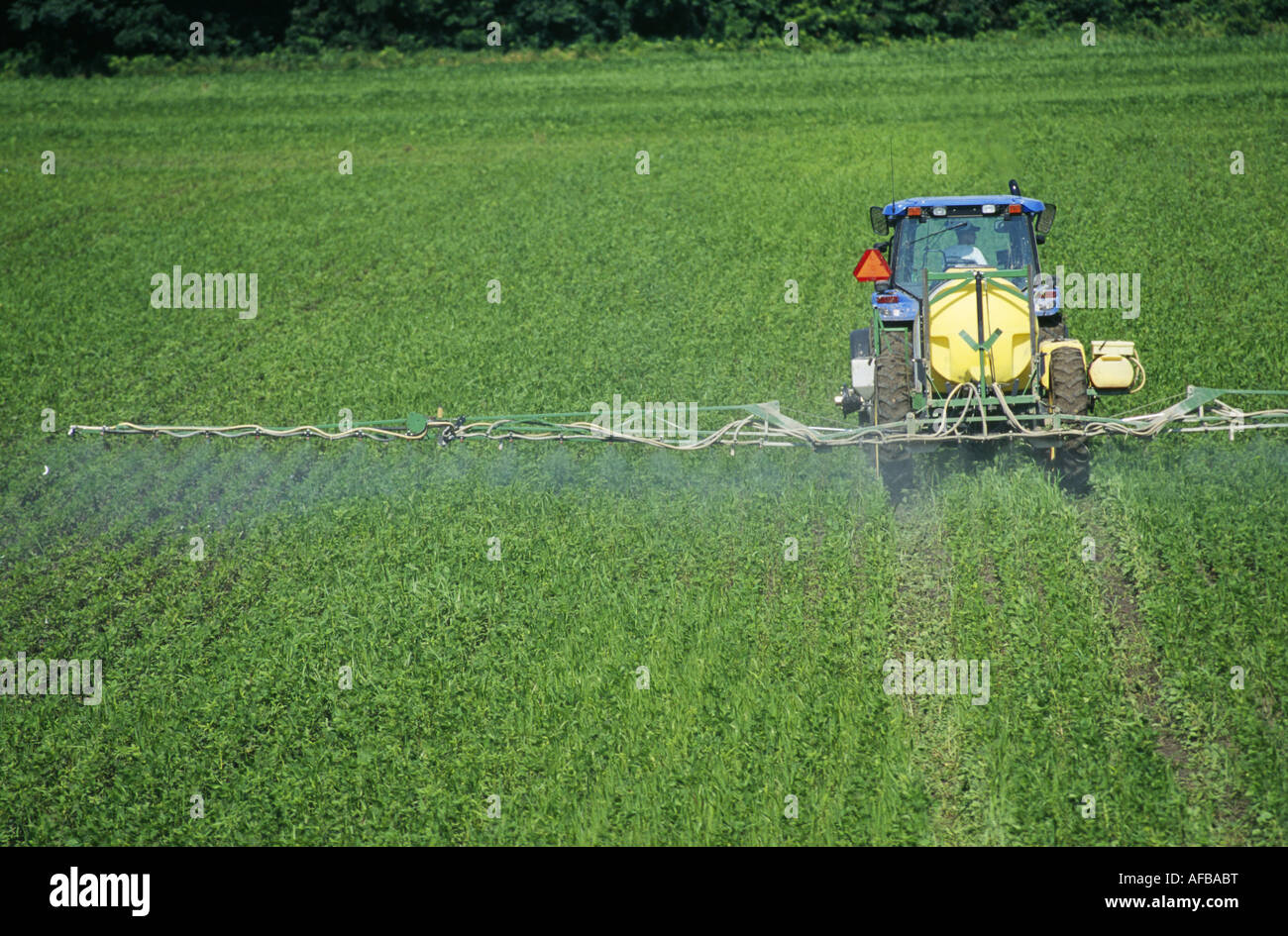 Post Emergence Application Of Herbicide To Soybeans Using Pull Type Spreader Missouri Stock Photo Alamy