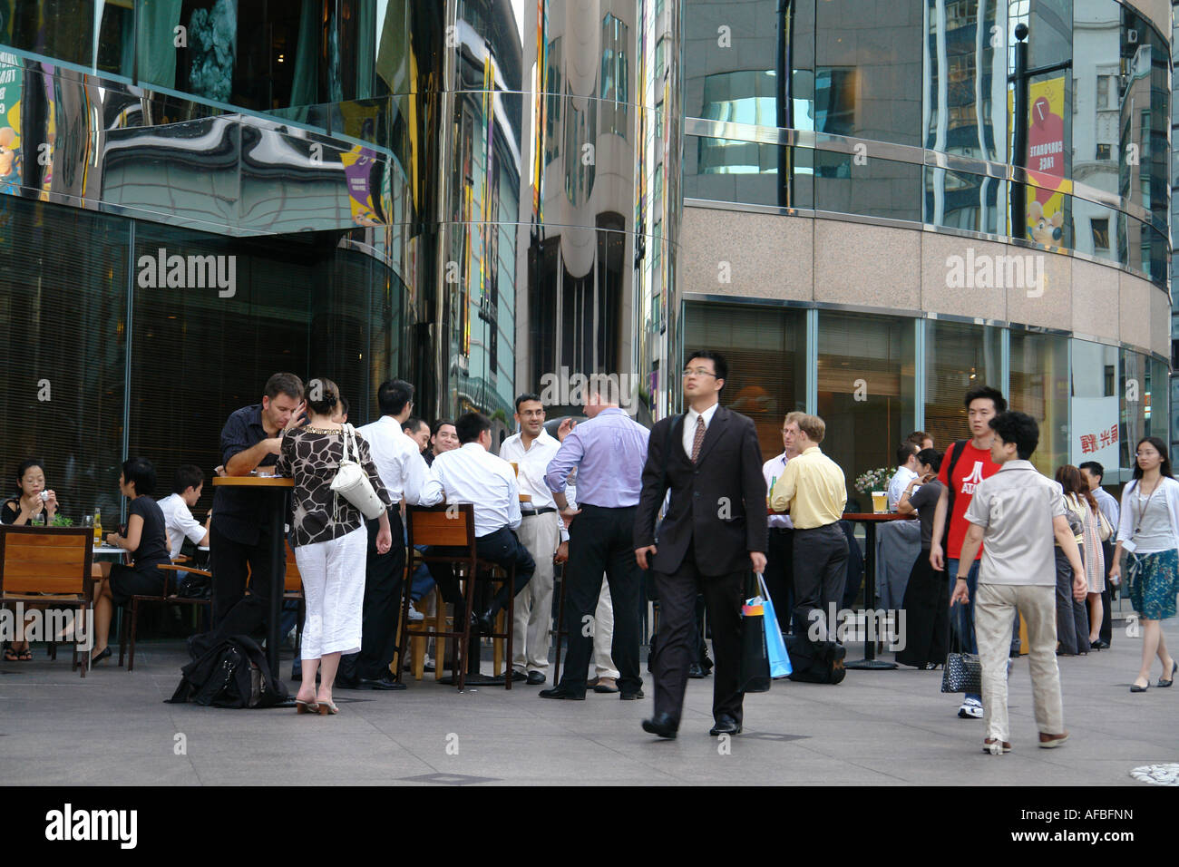 Office people enjoy happy hour outside of Exchange square central district Hong Kong China Stock