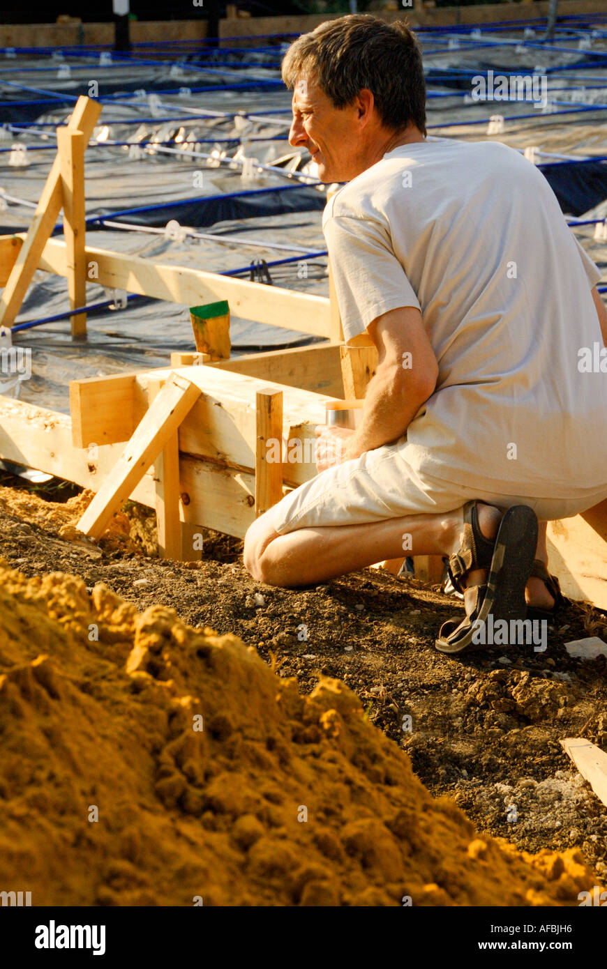 man kneeling Stock Photo