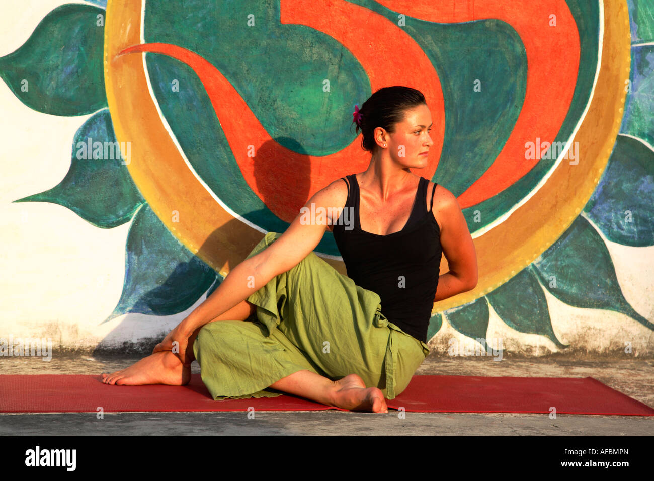India Rishikesh yoga female model doing yoga spinal twist April 2007