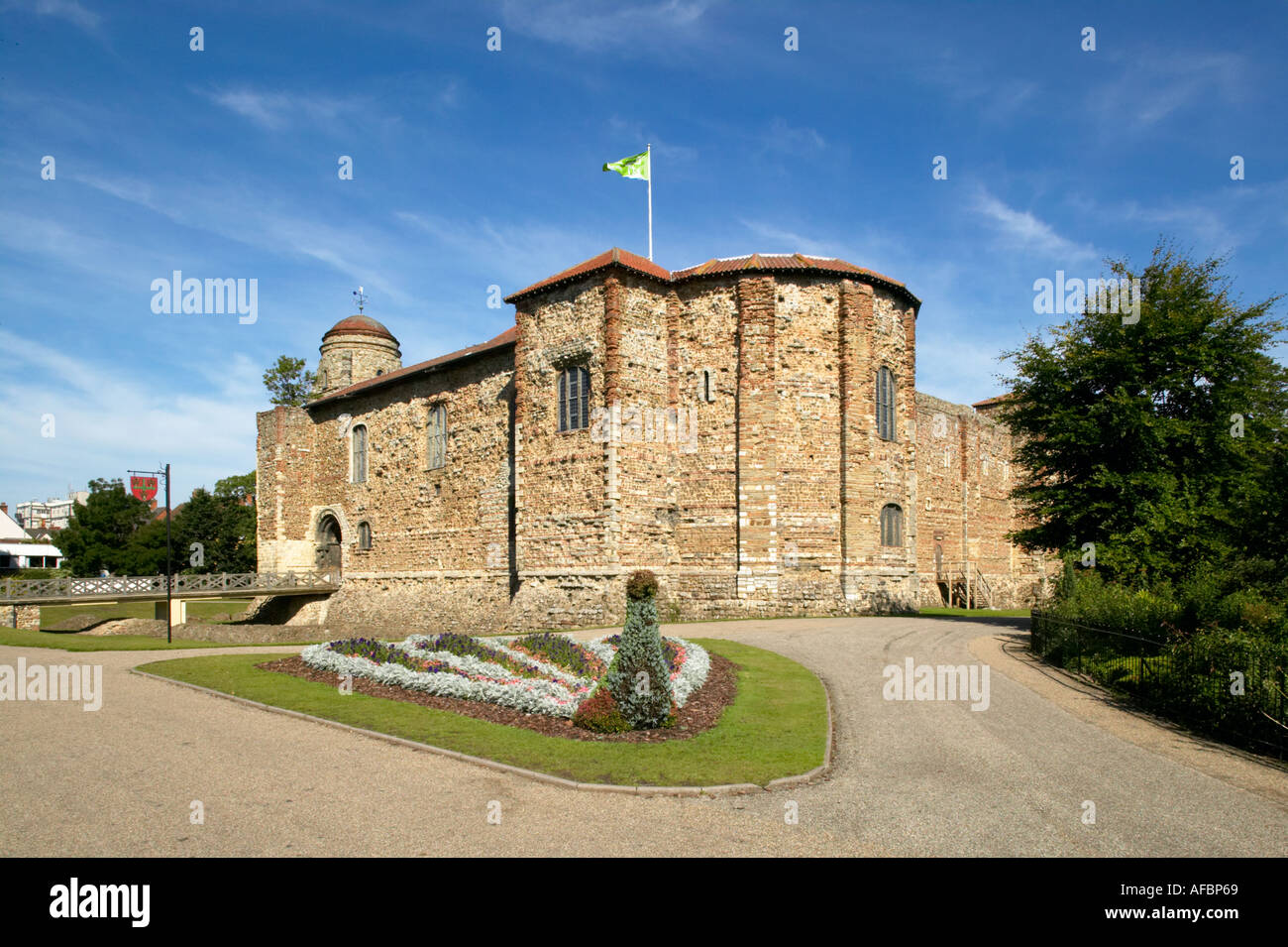 England Essex Colchester Castle and Decorative Peacock Flower Bed Stock Photo
