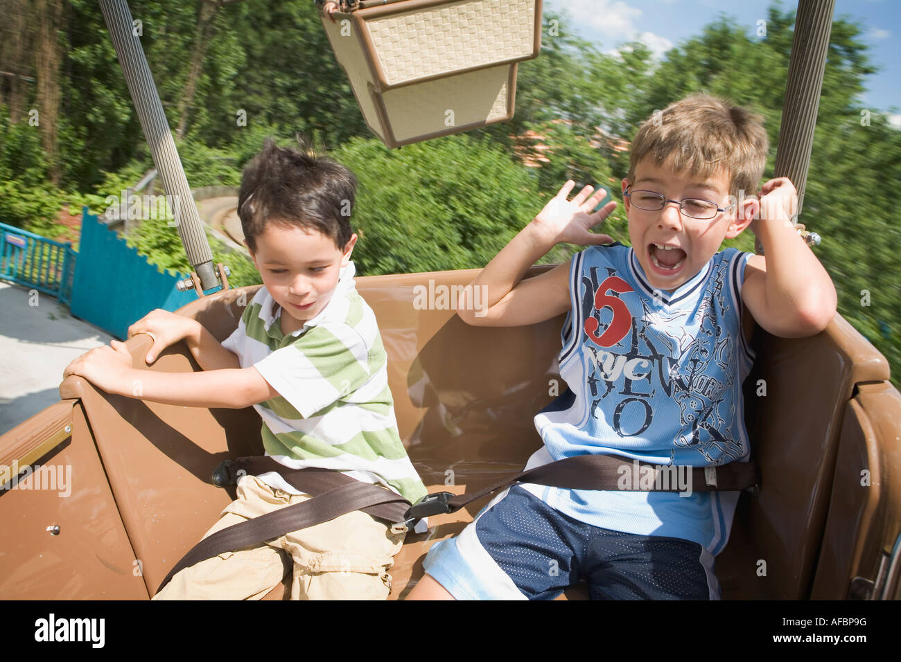 Two little boys on an amusement park ride Model Released Stock Photo ...
