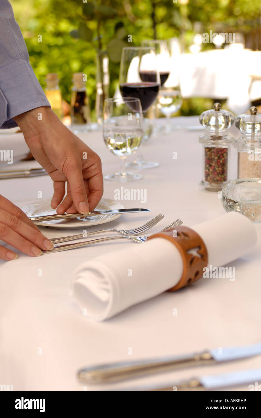 Waiter laying table Stock Photo Alamy