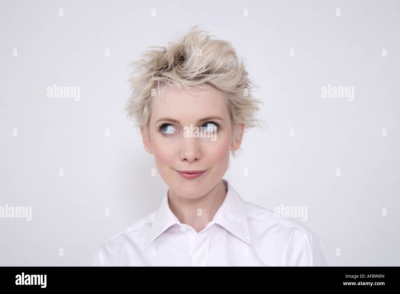 Young woman rolling eyes, portrait Stock Photo Alamy