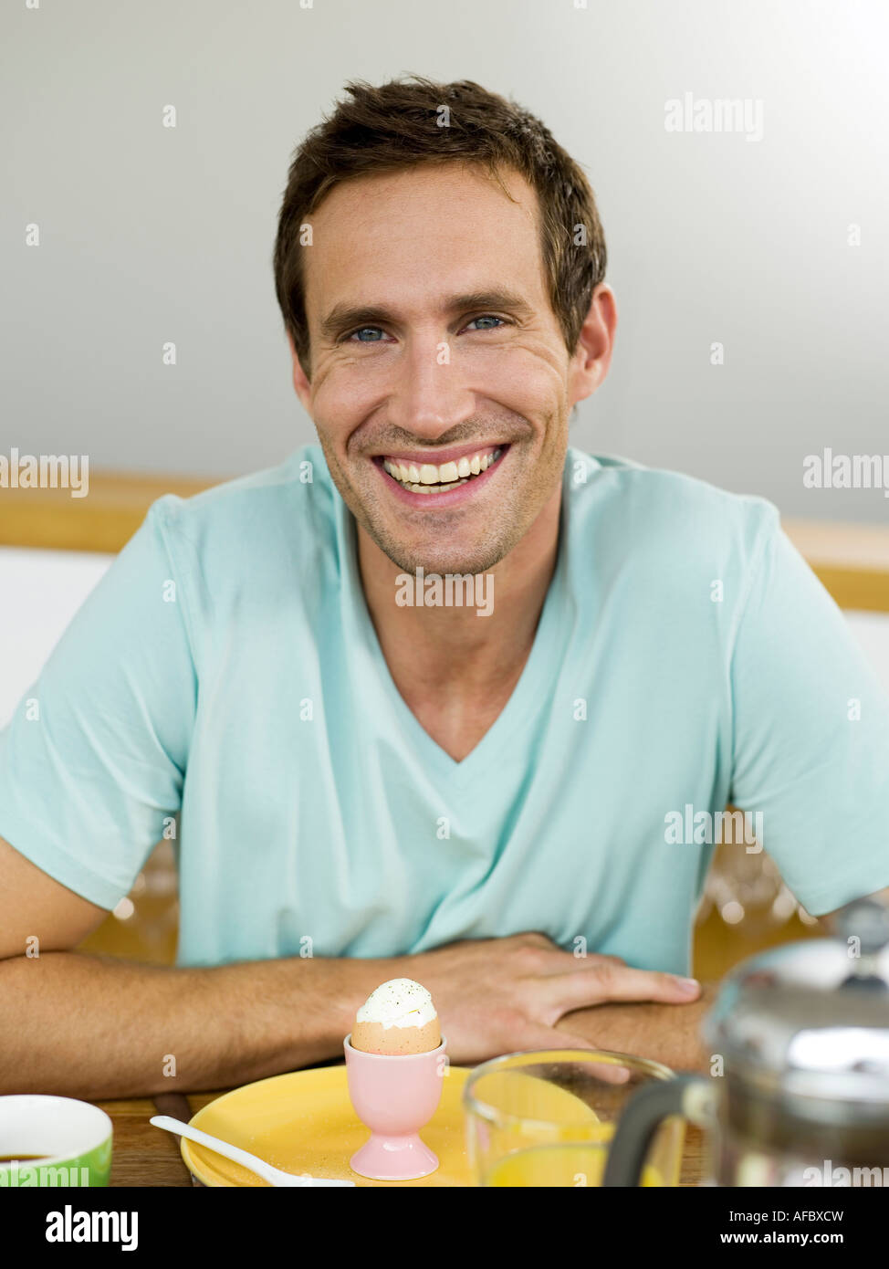 man-sitting-at-breakfast-table-stock-photo-alamy