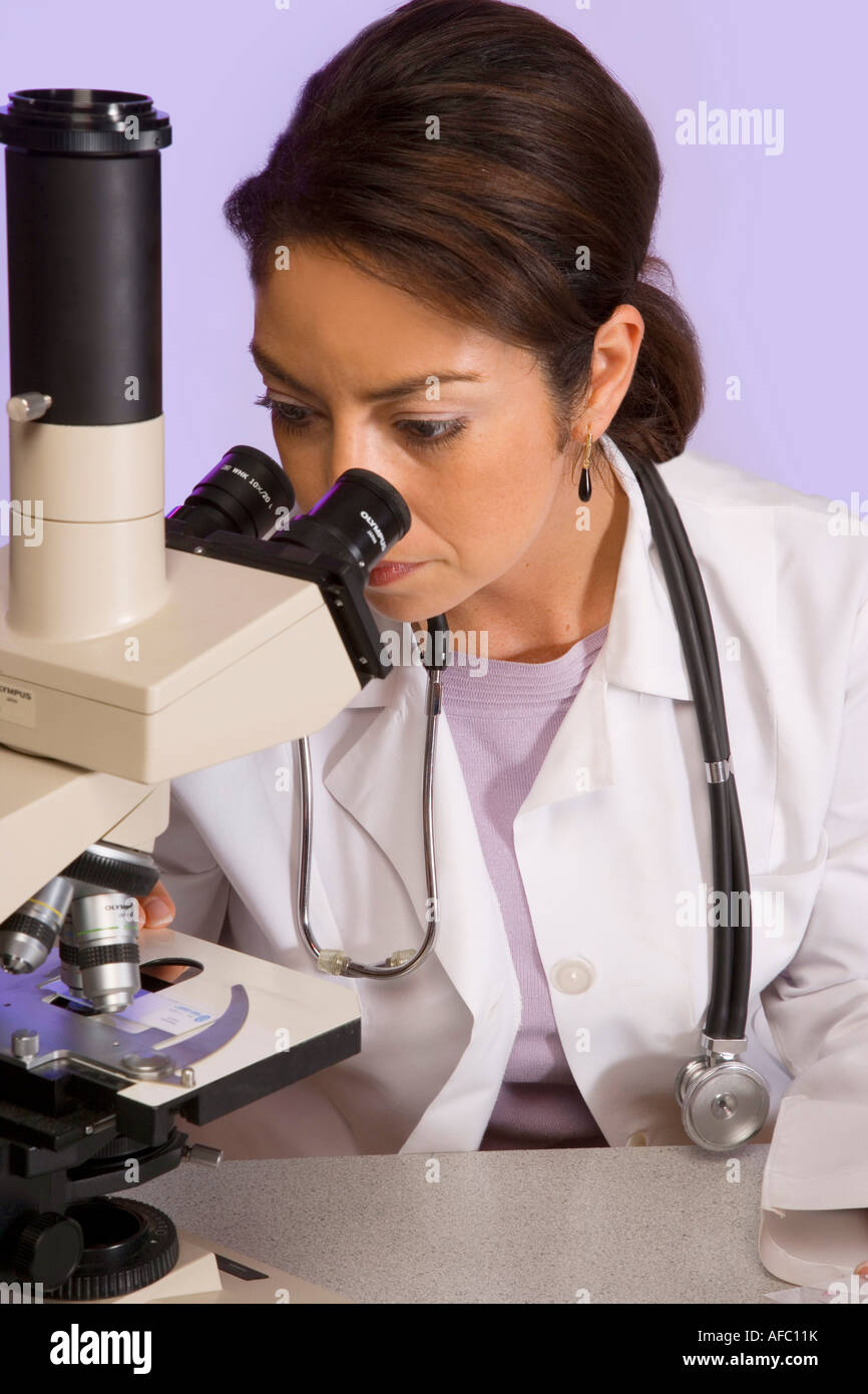 Viewing specimens under the microscope Stock Photo Alamy