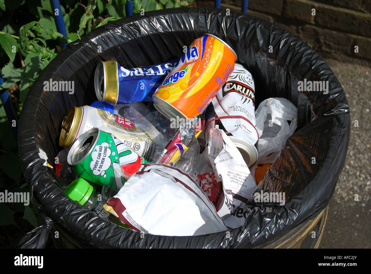 Rubbish bin, empty cans Woking, Surrey, England, United Kingdom Stock Photo