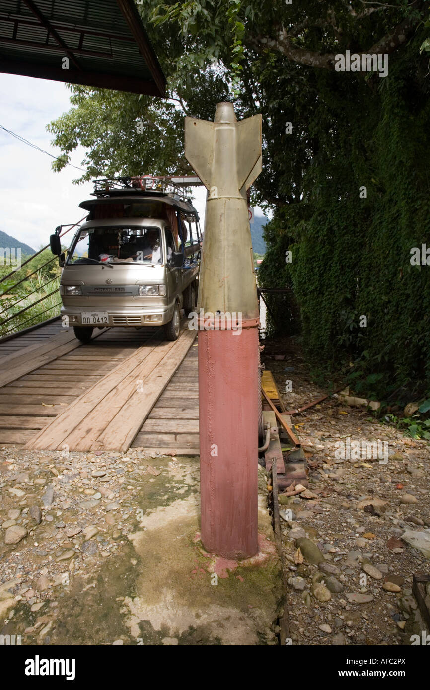 Bridge over the river Nam Song with bomb casings as bollards, on the way to the Tham Phu Kham (Poukham) cave, Vang Vieng, Laos Stock Photo
