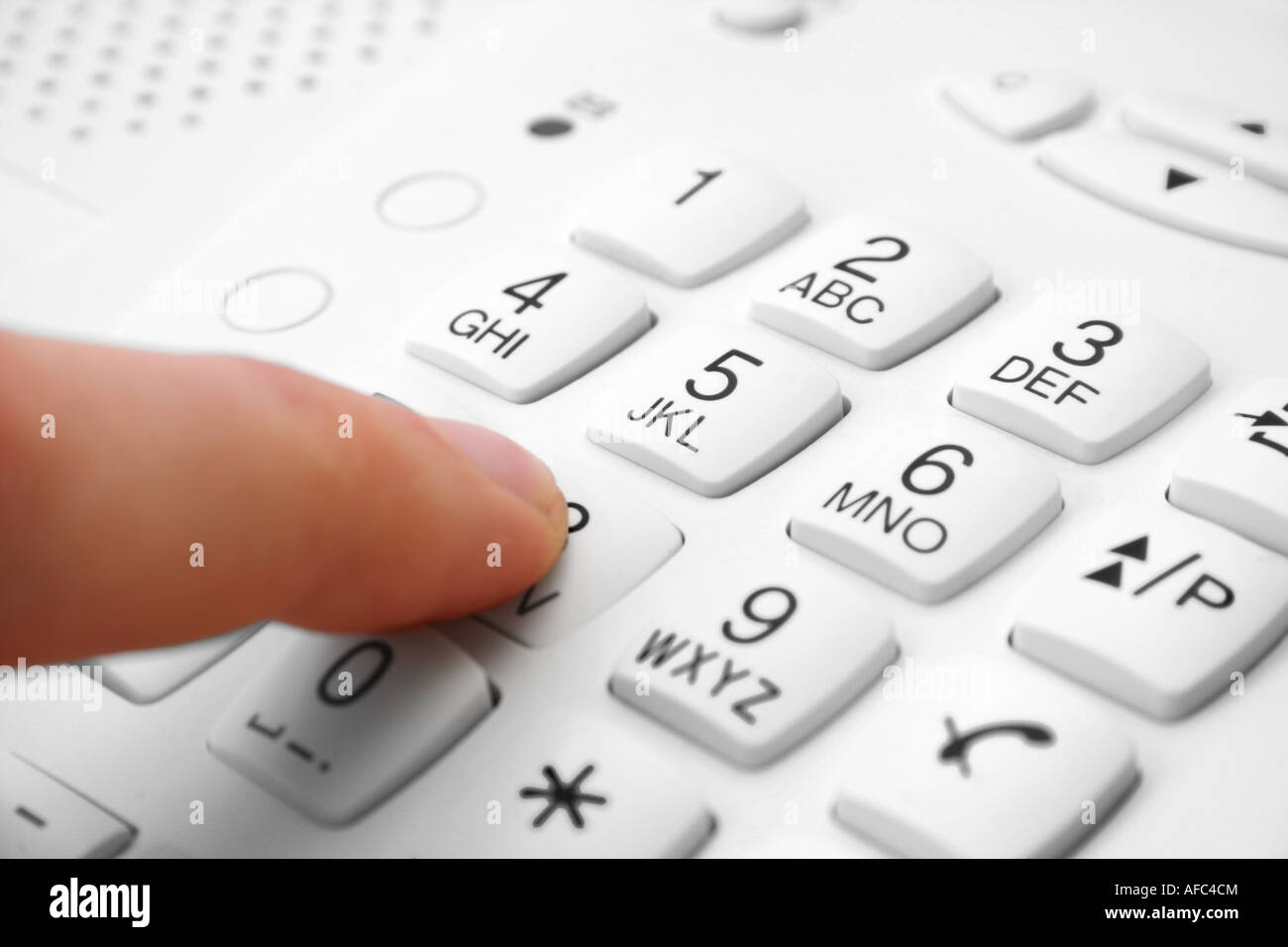 finger presses figure on phone focus on five Stock Photo Alamy