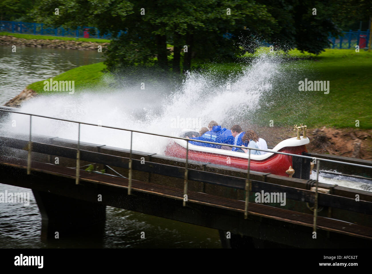 Group of people on water flume theme park ride Stock Photo - Alamy