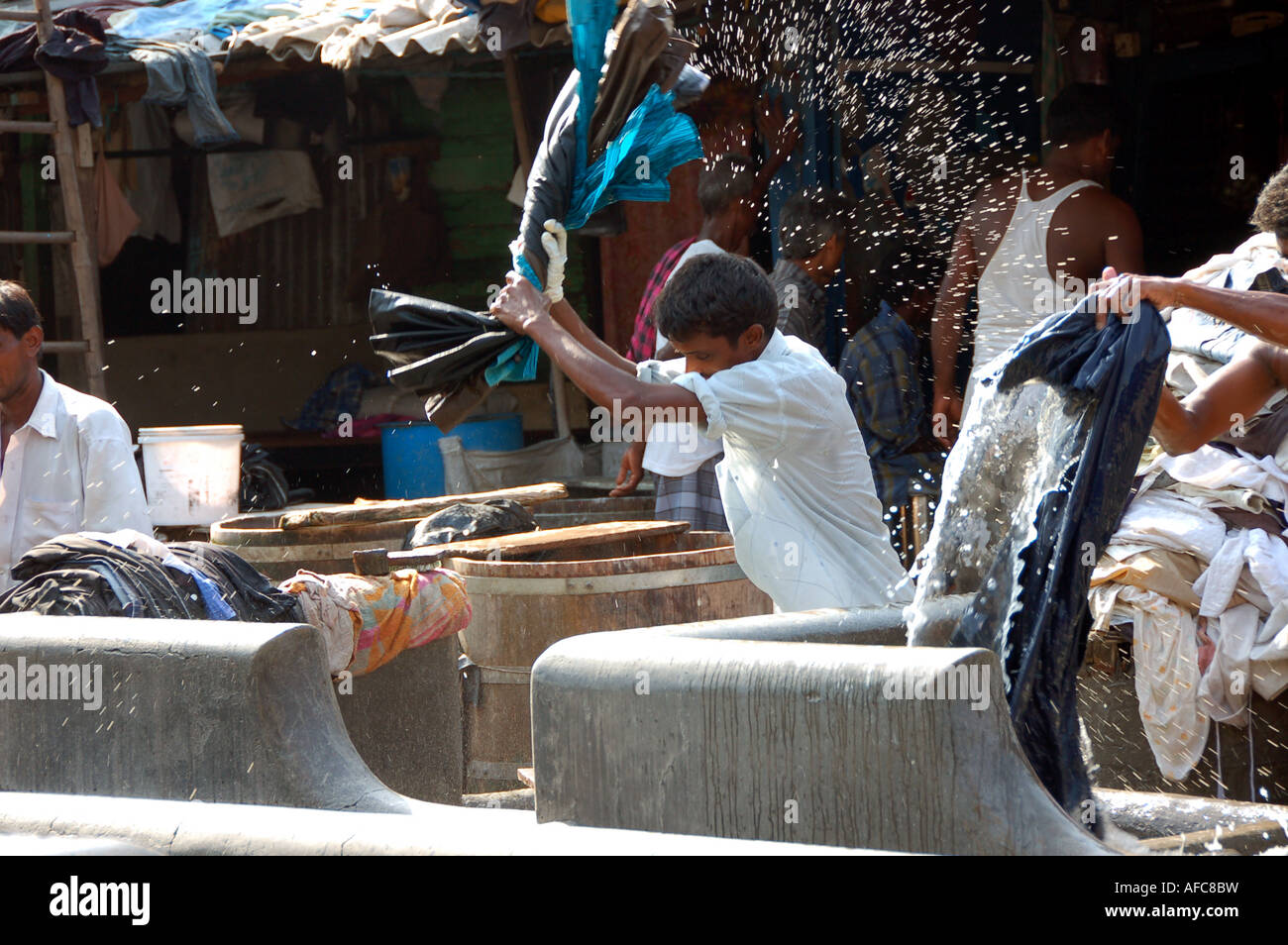 Man washing clothes at Dhobi Ghat laundry in Mumbai, India Stock Photo