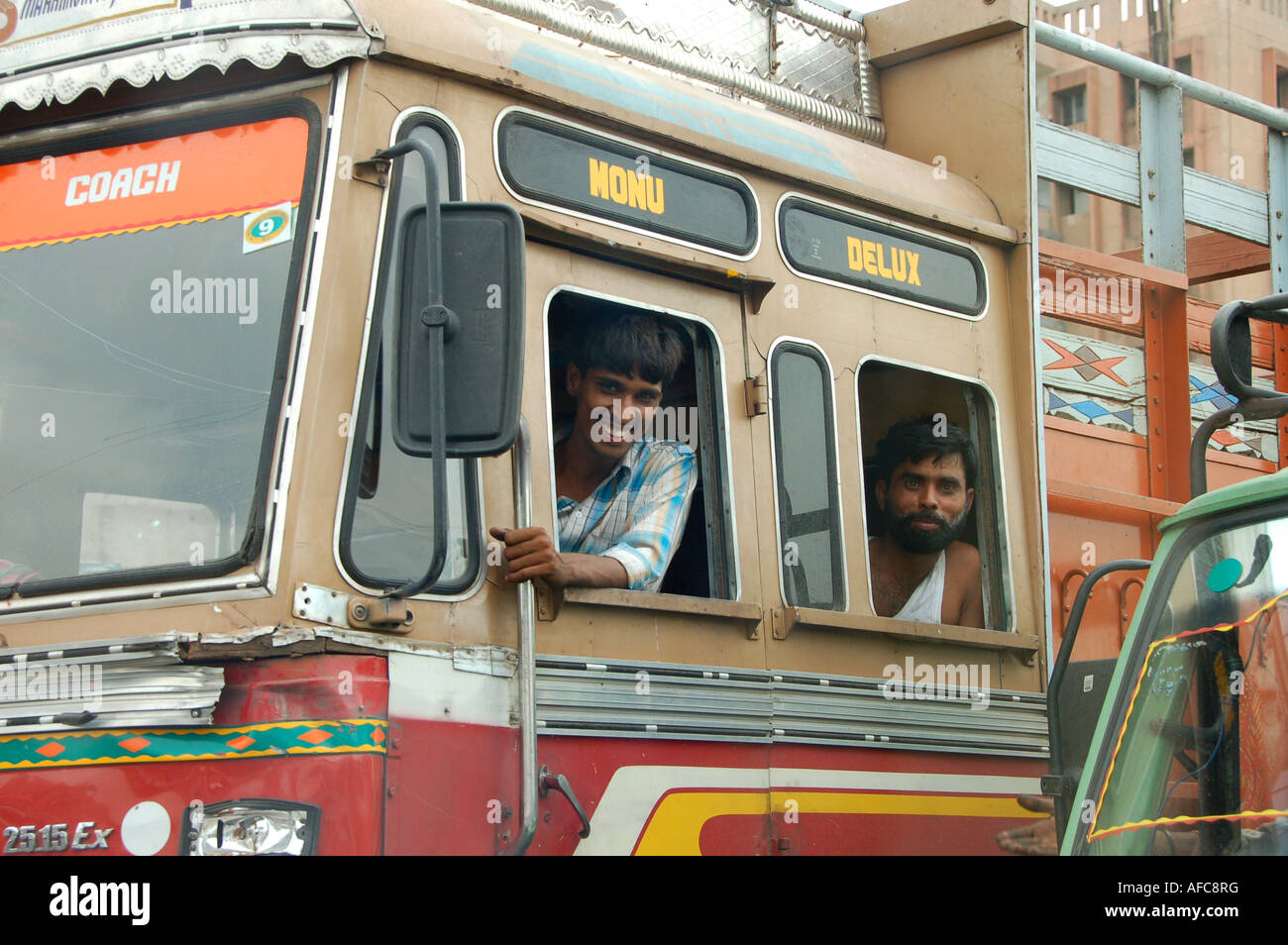 Smiling driver and passenger in a truck in India Stock Photo - Alamy