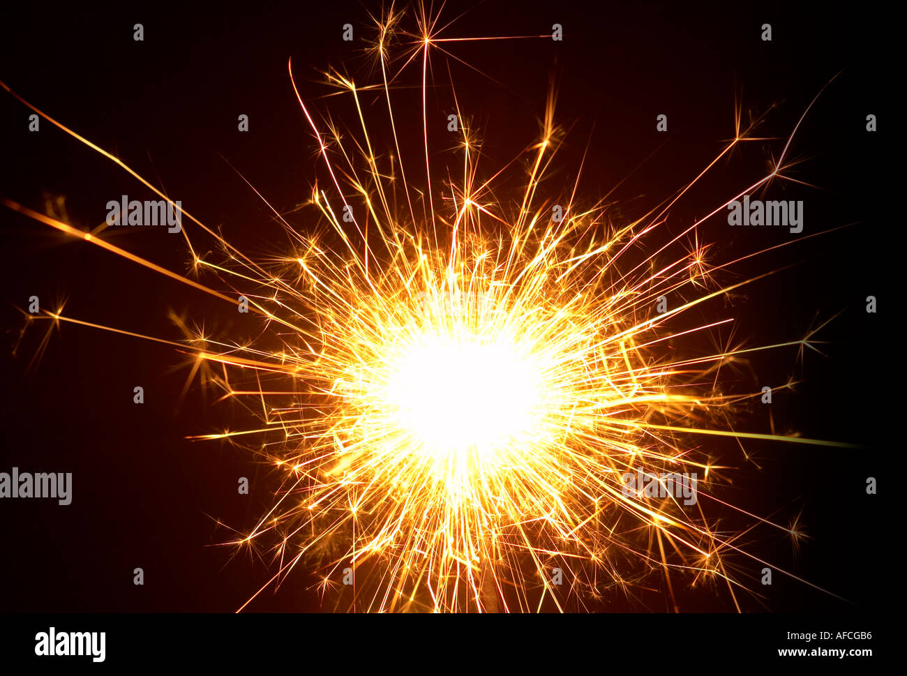 Sparkler flames against black background Stock Photo