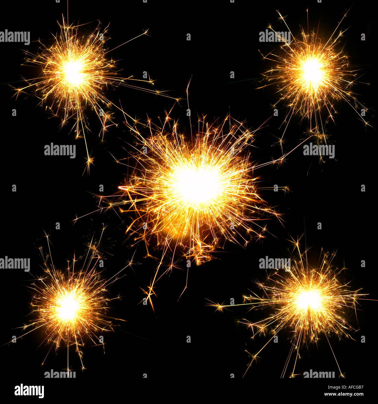 Five sparkler flames against black background Stock Photo