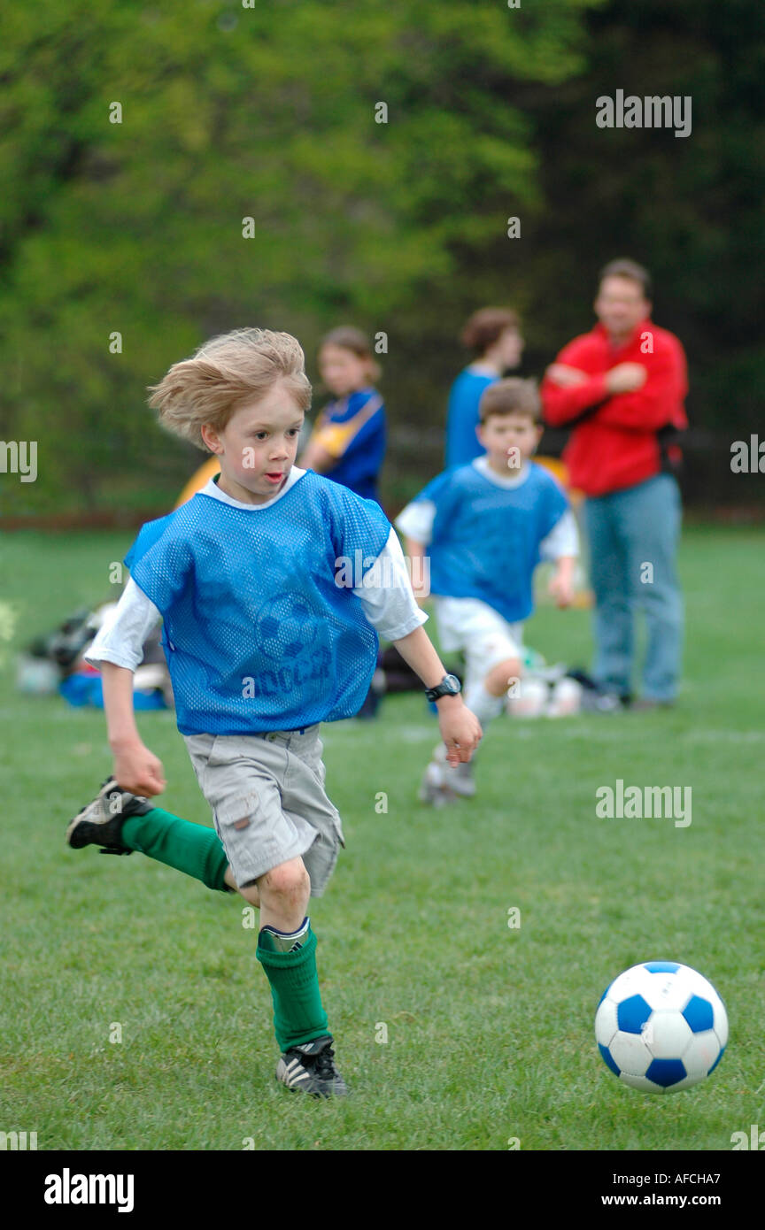 Boy playing soccer football Stock Photo
