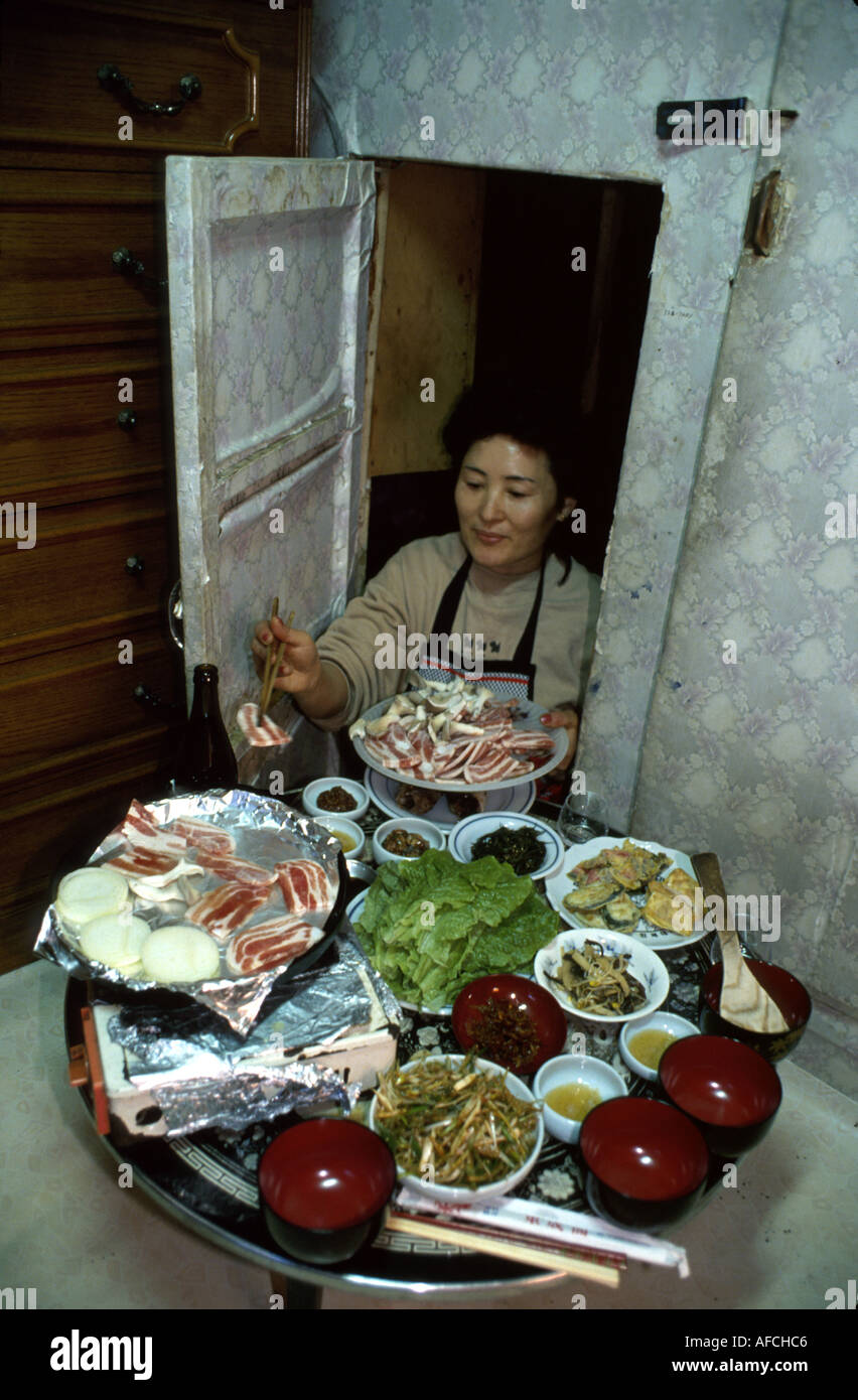 South Korea,Korean Peninsula,Eastern Asia,Asian Far East,Eastern,Orient,Seoul,Asian woman,female,women,prepares special meal,occasion,feast,tradition, Stock Photo