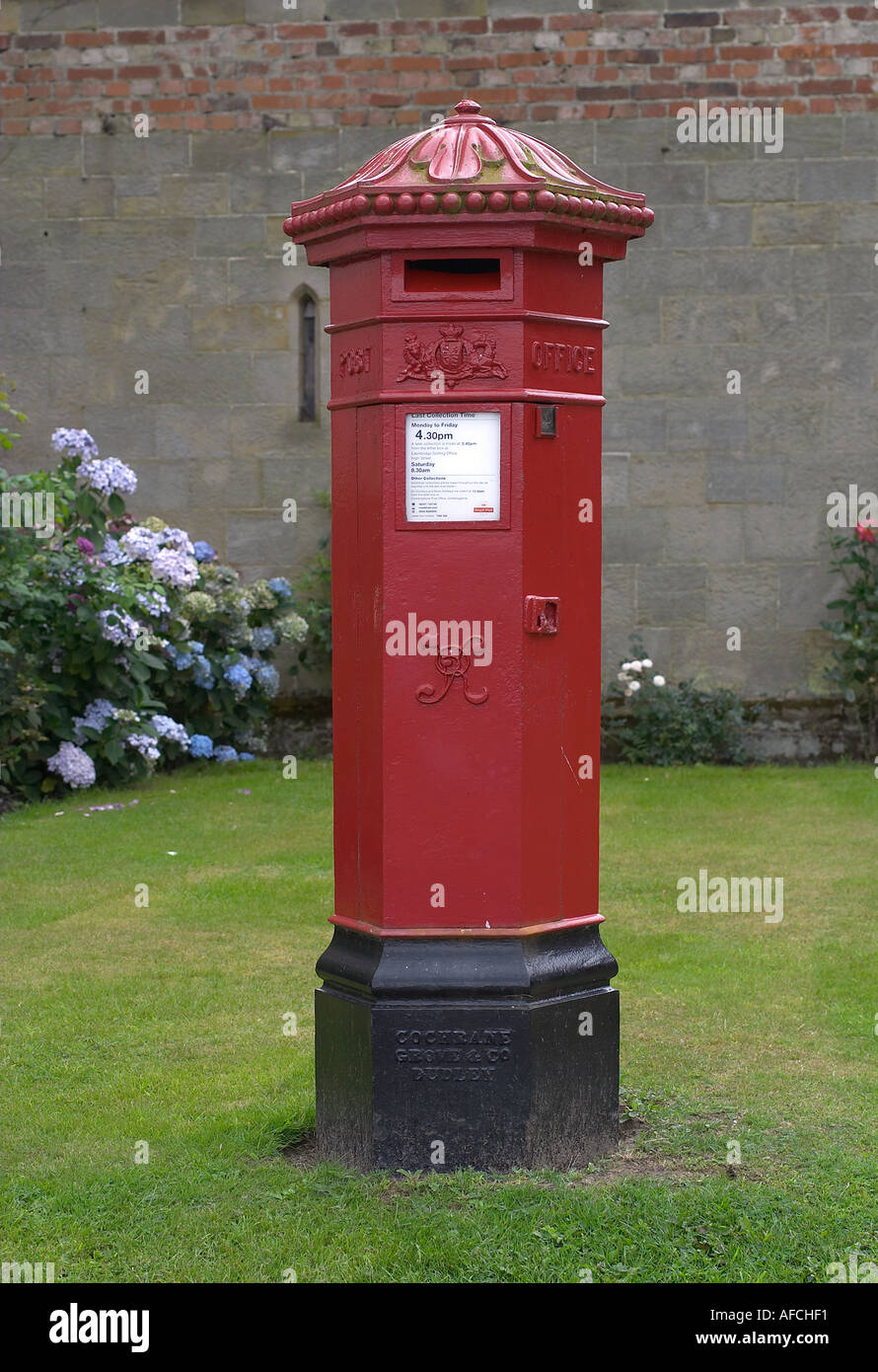 Decorative red Victorian pillar box manufactured by Cochrane Grove and