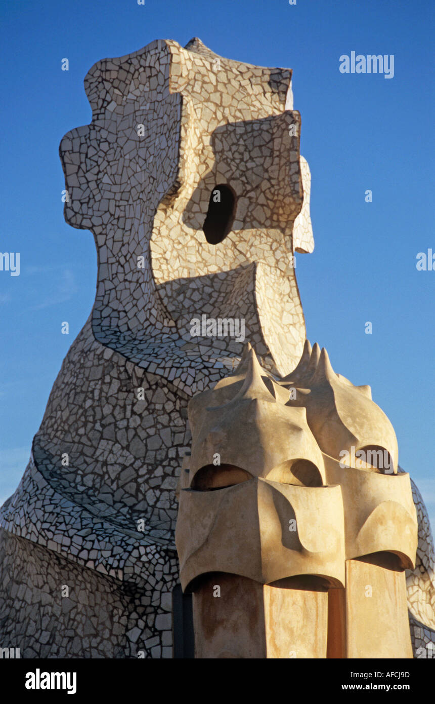 Distinctive forms crosses and chimneys jut from the roof of Casa Battló, Antoni Gaudí's striking apartment building in Barcelona Stock Photo