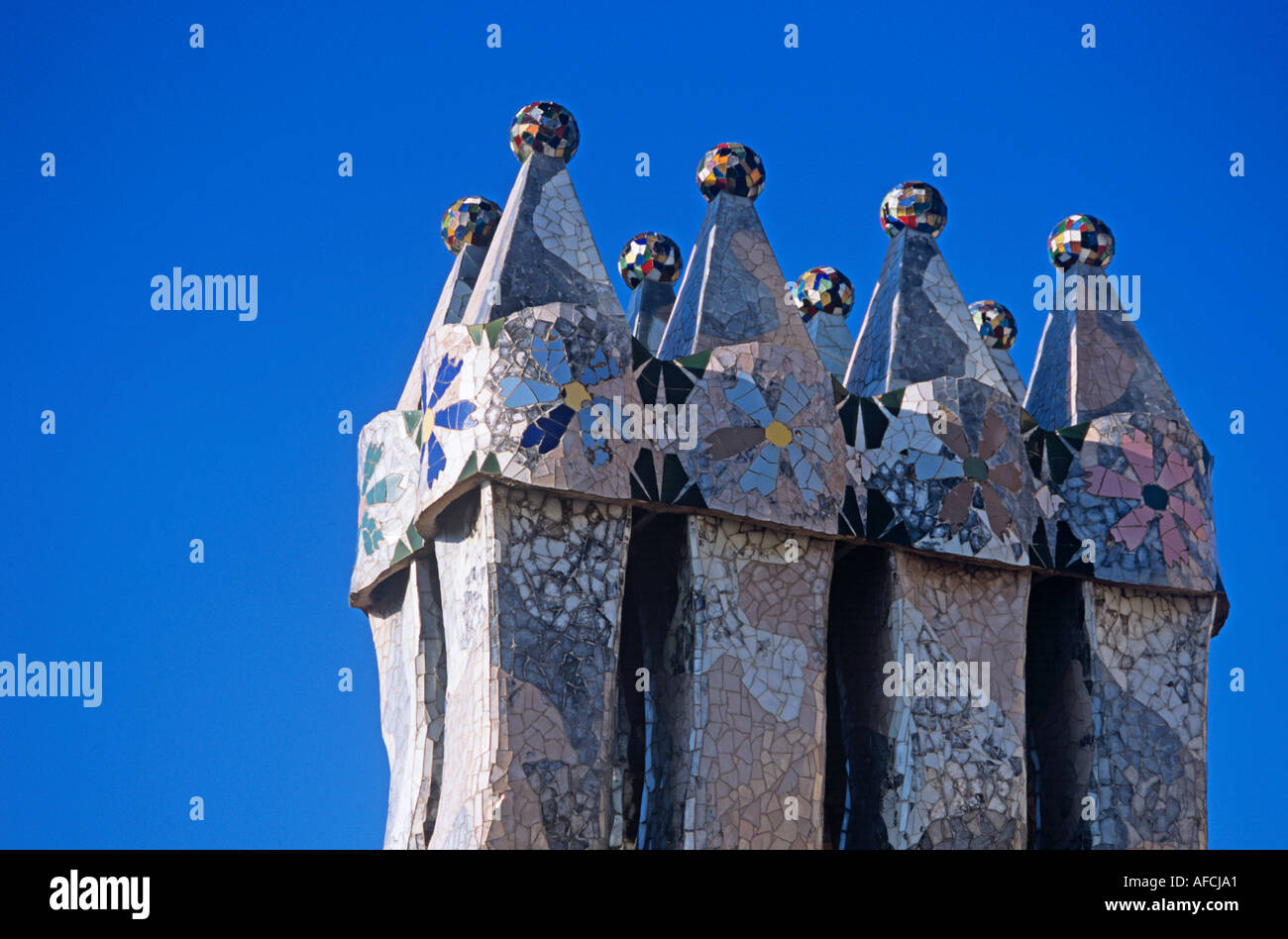 Bizarre chimneys jut from the roof of Casa Battló, Anton Gaudí's Modernist apartment house in Barcelona Stock Photo