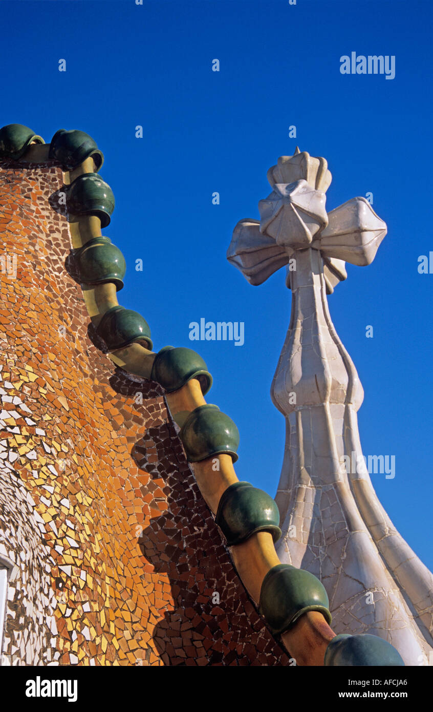Bizarre forms crosses and chimneys jut from the roof of Casa Battló Antoni Gaudí's Modernist apartment building in Barcelona Stock Photo
