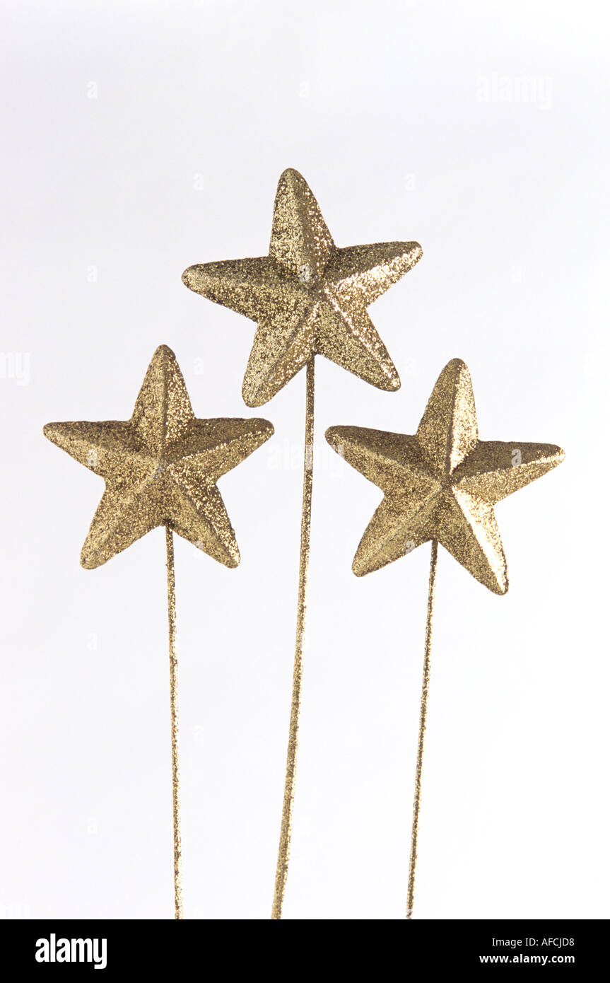 GOLD CHRISTMAS STARS ON WHITE BACKGROUND Stock Photo - Alamy