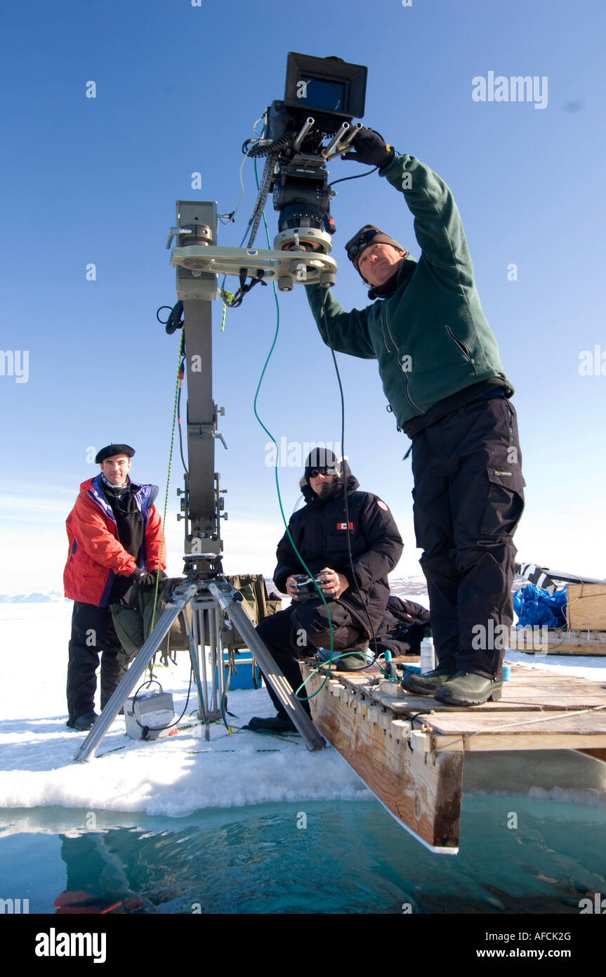 Film crew working in high arctic spring with 35mm Aaton camera + Gib arm.Behind the scenes on Galatee/disneynature Oceans movie Stock Photo