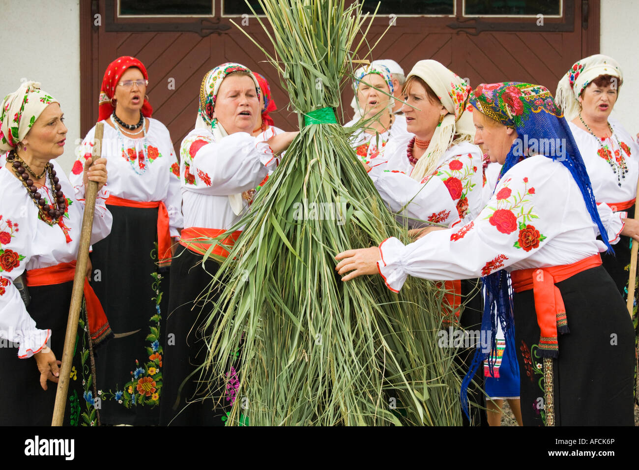 Countrywomen dressed in traditional Ukrainian costumes, performing a