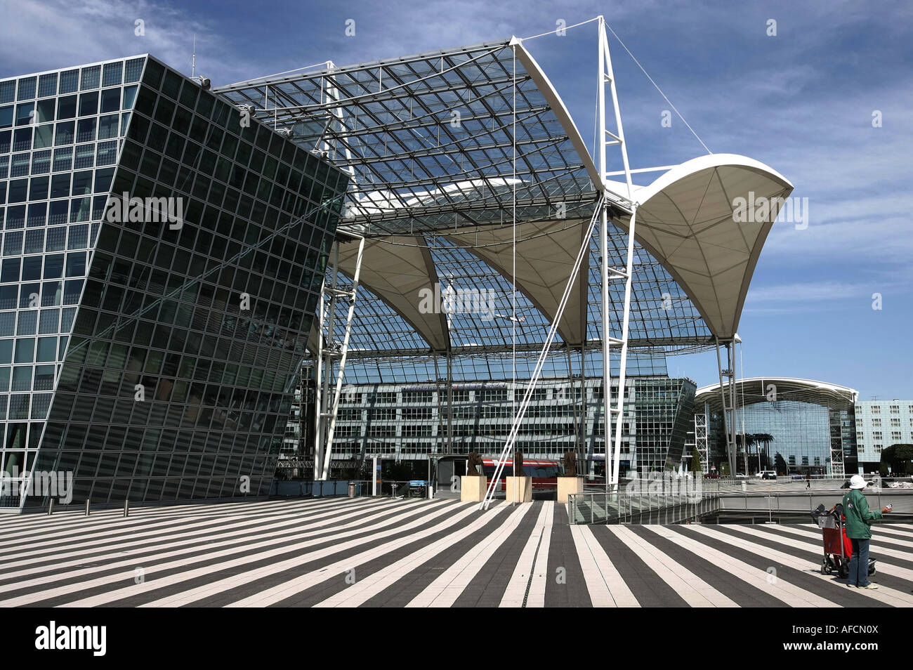 Illustration Airport: Travelers in front of Terminal 2 at Munich Airport Muenchen Airport, am 04.09.2007 Stock Photo