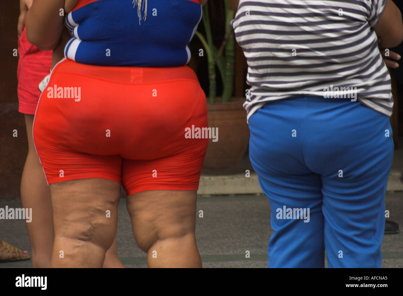 Cuba Havana close up of two women seen from the back one of them rather fat  and difform wearing tight shorts Stock Photo - Alamy