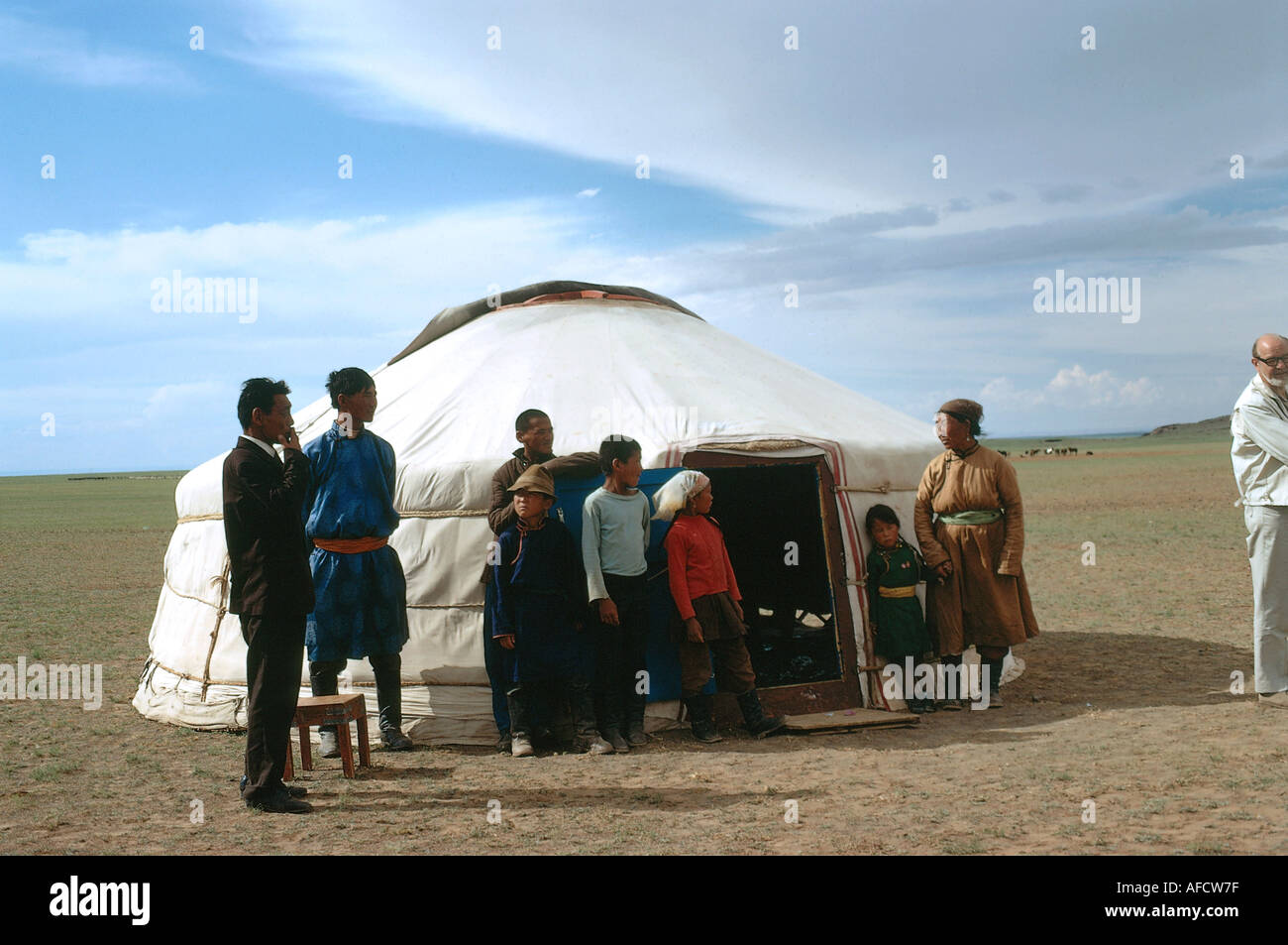 geography / travel, Mongolia, people, family standing in front of round house, , Stock Photo