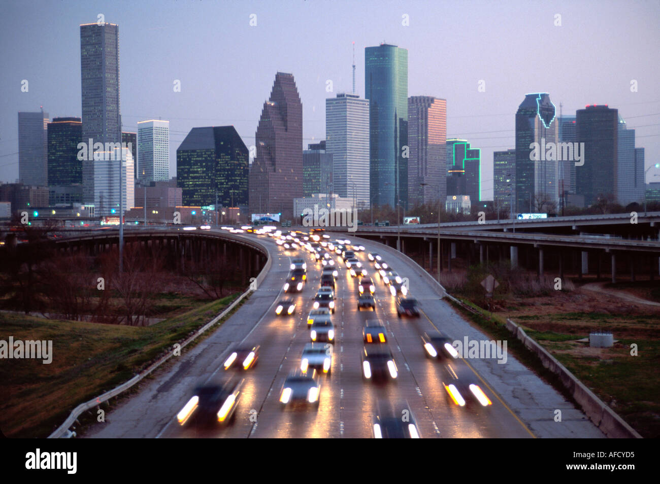 Texas,Lone Star State,The Southwest,Harris County,Houston,Interstate 45,commuter rush hour traffic,transportation,vehicles,city skyline,downtown,city Stock Photo