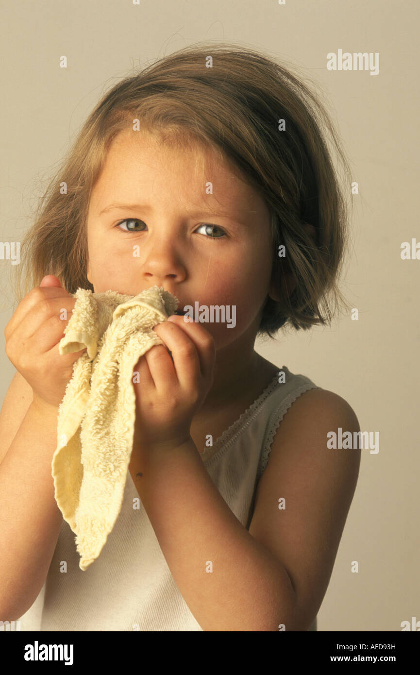 child rubbing her face with a flannel Stock Photo Alamy