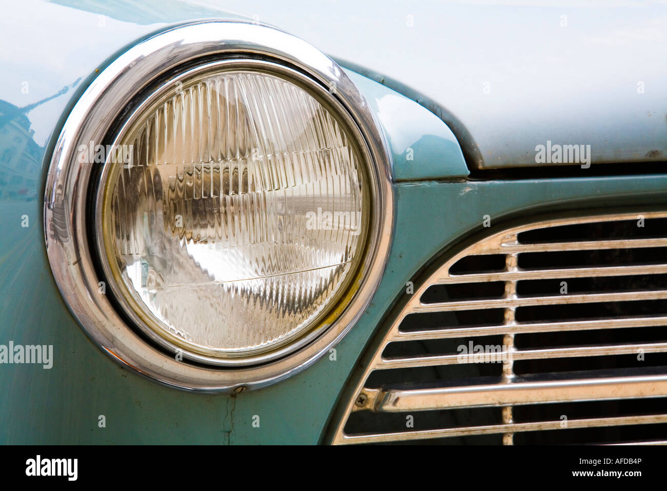 Detail of a vintage car headlight and front grille Stock Photo - Alamy