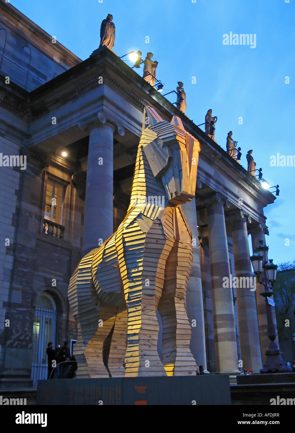 Wooden Trojan horse by Philippe Miesch in front of Opera house at dusk, Strasbourg, Alsace, France Stock Photo