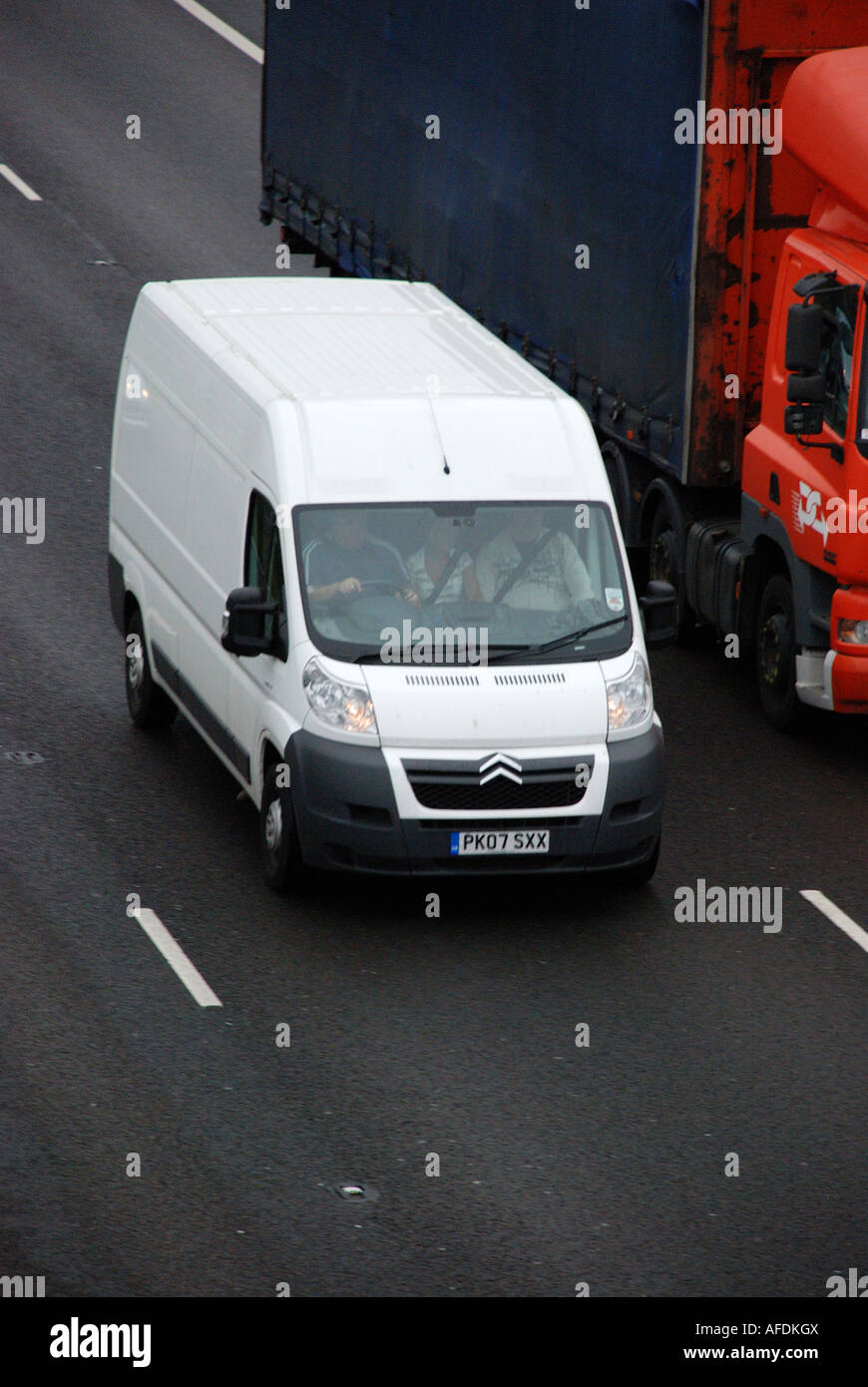 Citroen van passing a truck on the M62 motorway near Huddersfield. Stock Photo