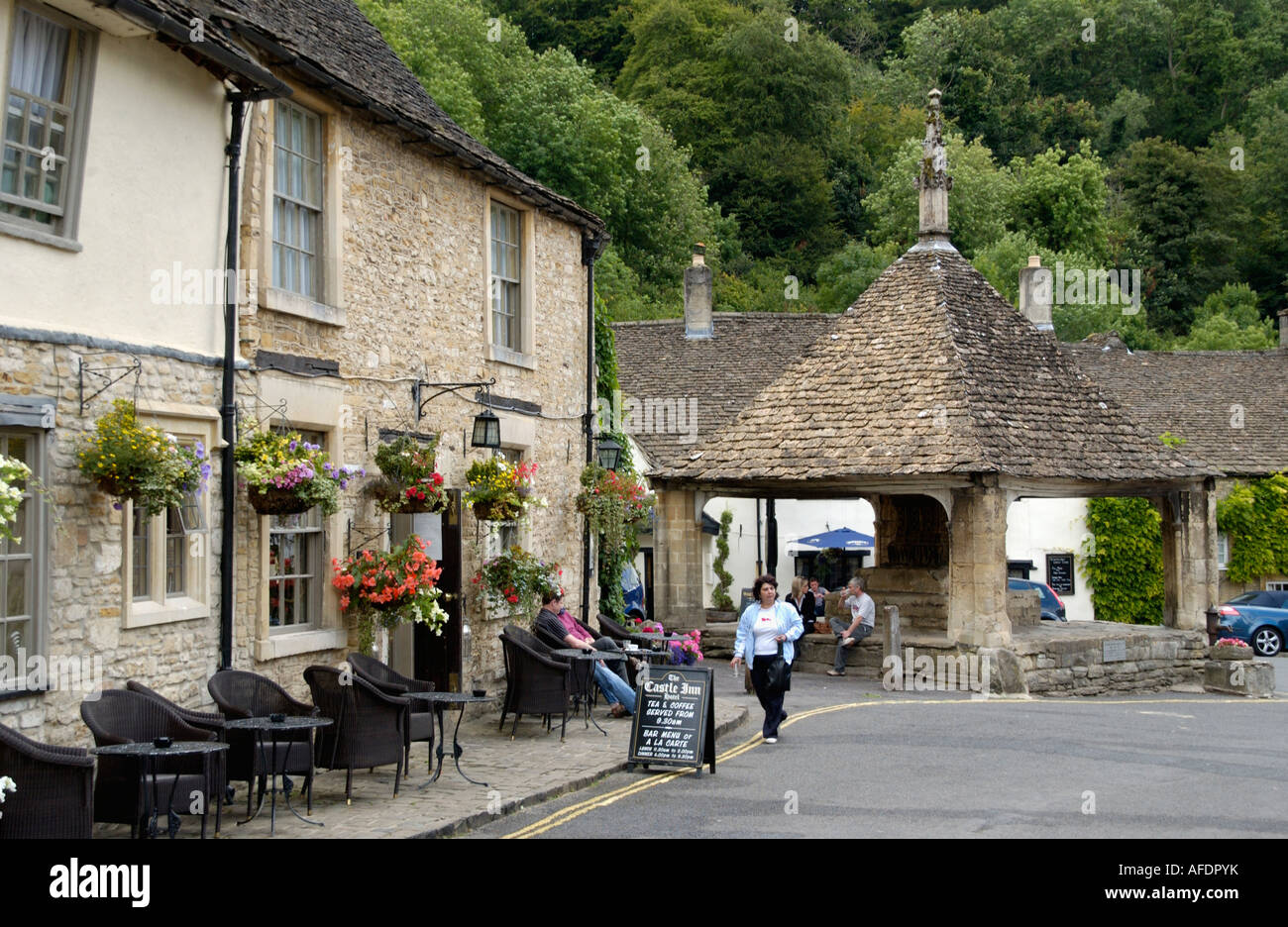 Castle Inn in Castle Combe Wiltshire England UK and Market Cross Stock