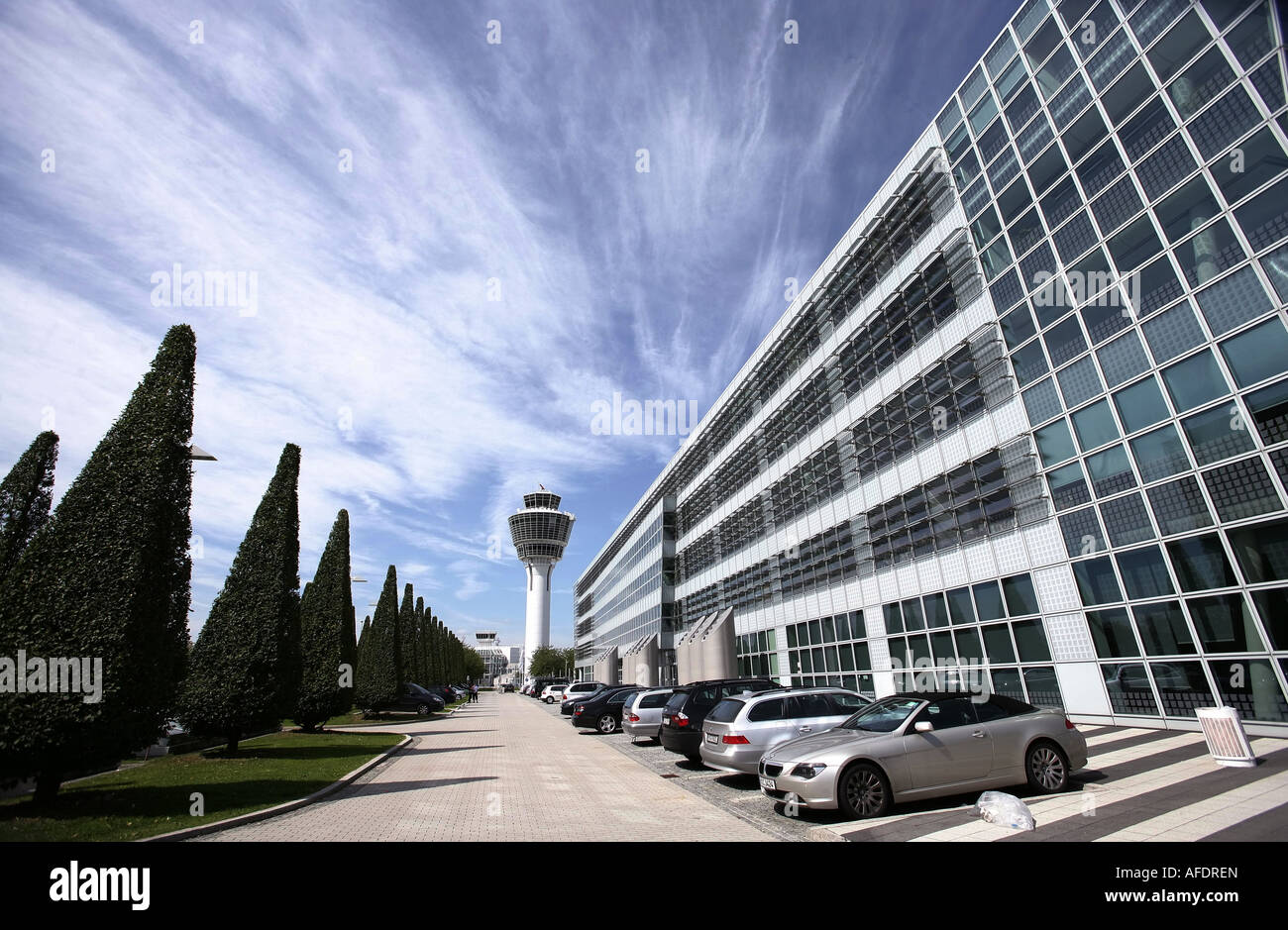 Illustration Airport: Munich Airport exterior view with tower, trees and office buildings Stock Photo