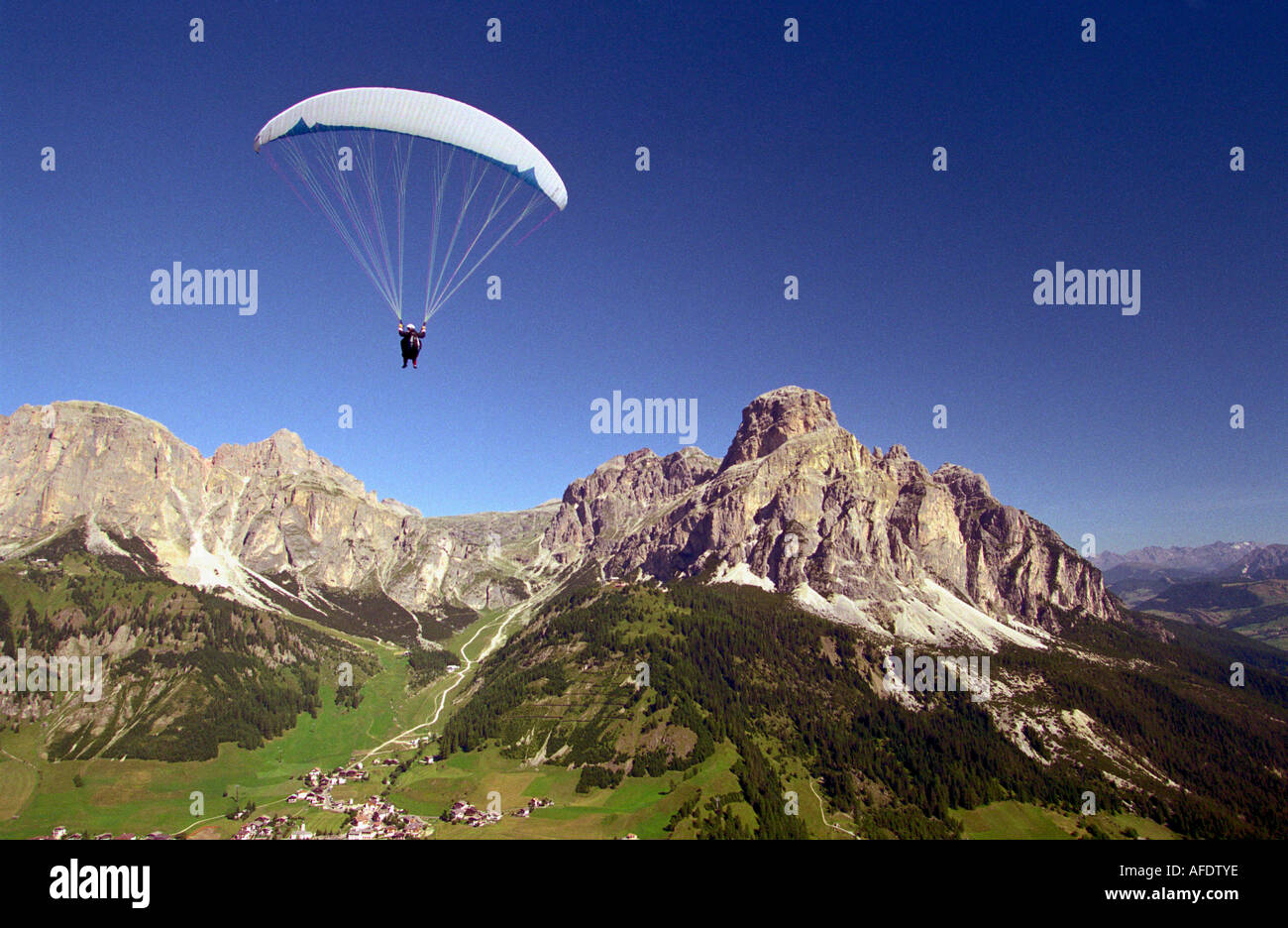Paragliding over Corvara, Sassongher right side, Dolomites, Alta Badia South Tyrol. Italy Stock Photo