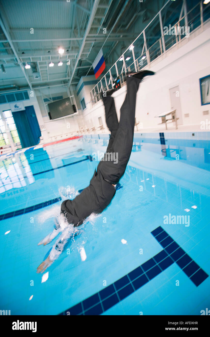 Businessman jumping in pool Stock Photo Alamy
