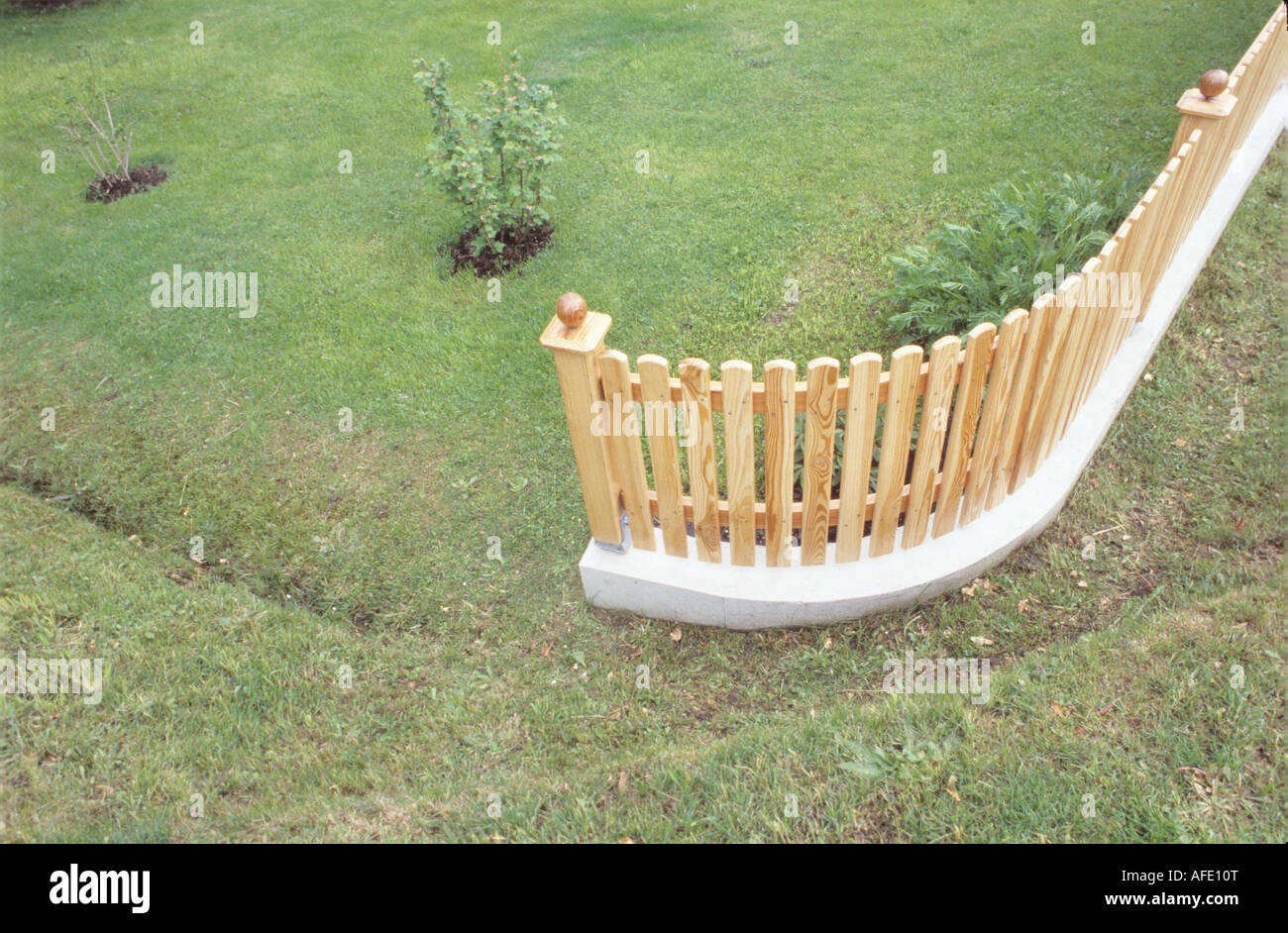 Garden with wooden fence Stock Photo - Alamy