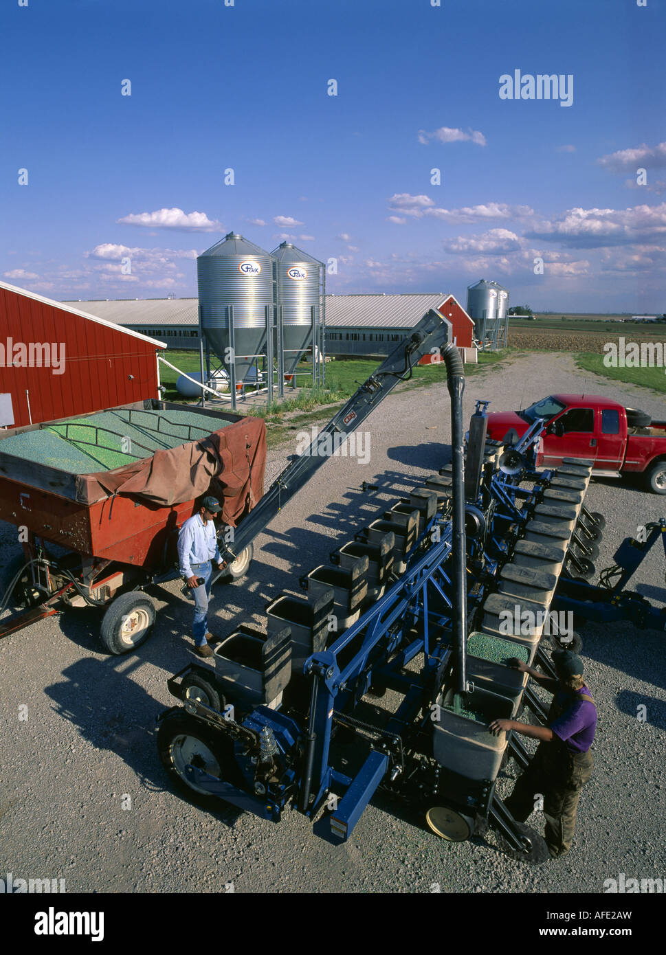 NO TILL PLANTER BEING FILLED WITH SOYBEANS IOWA CITY IOWA Stock Photo