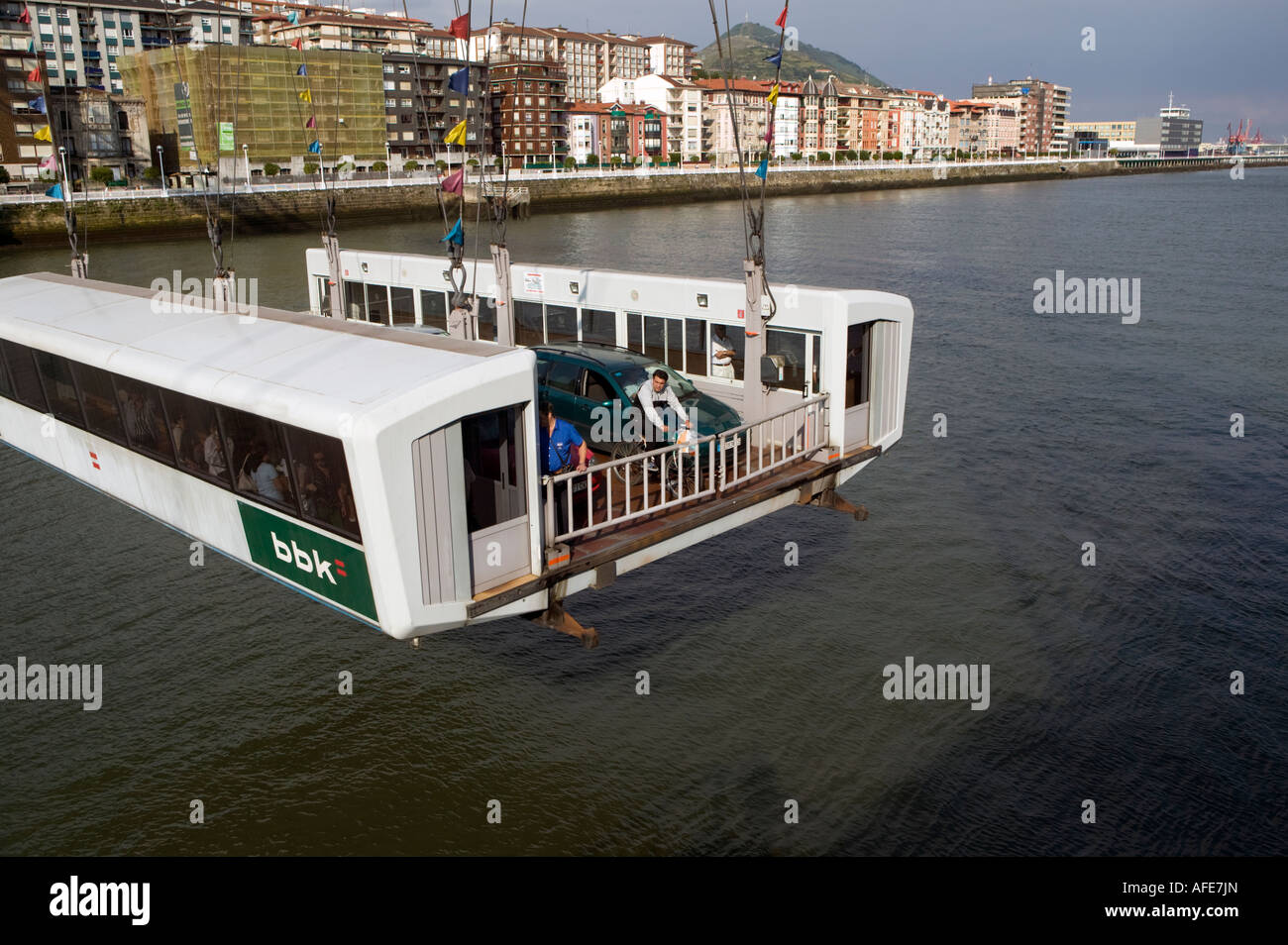 Transporter platform of Puente Colgante moving across Nervion seen from Las Arenas Areeta Getxo Basque Country northern Spain Stock Photo