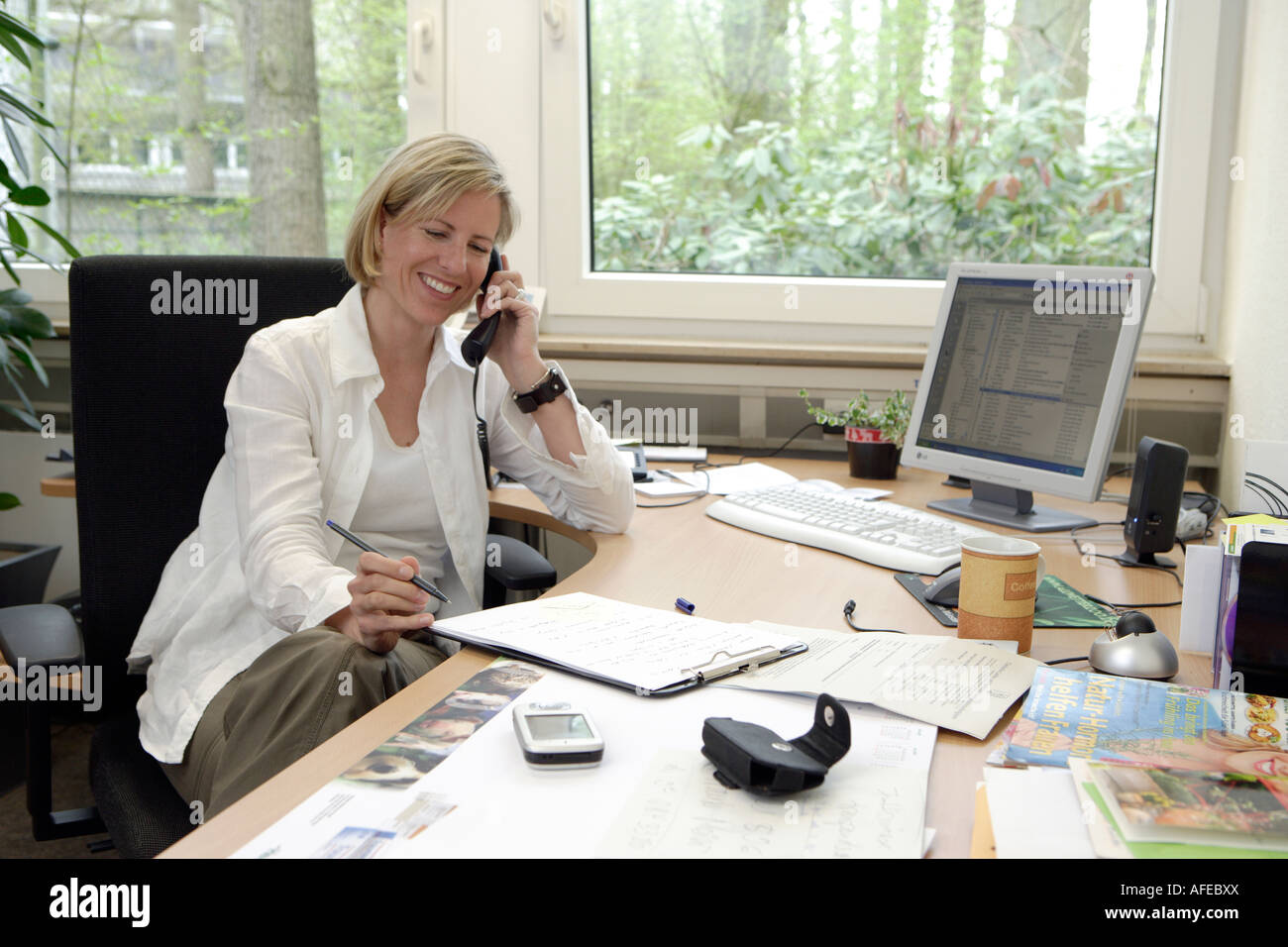 The zoo veterinary surgeon of the zoo Allwetterzoo Dr Sandra Silinski in her office Stock Photo