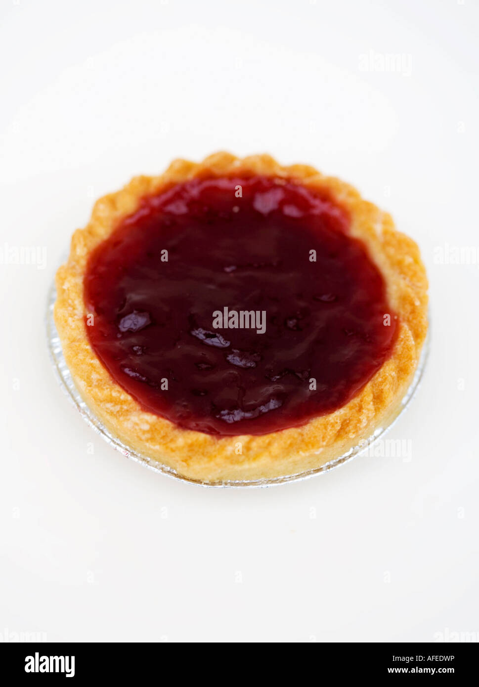 One jam tart against a white background Stock Photo