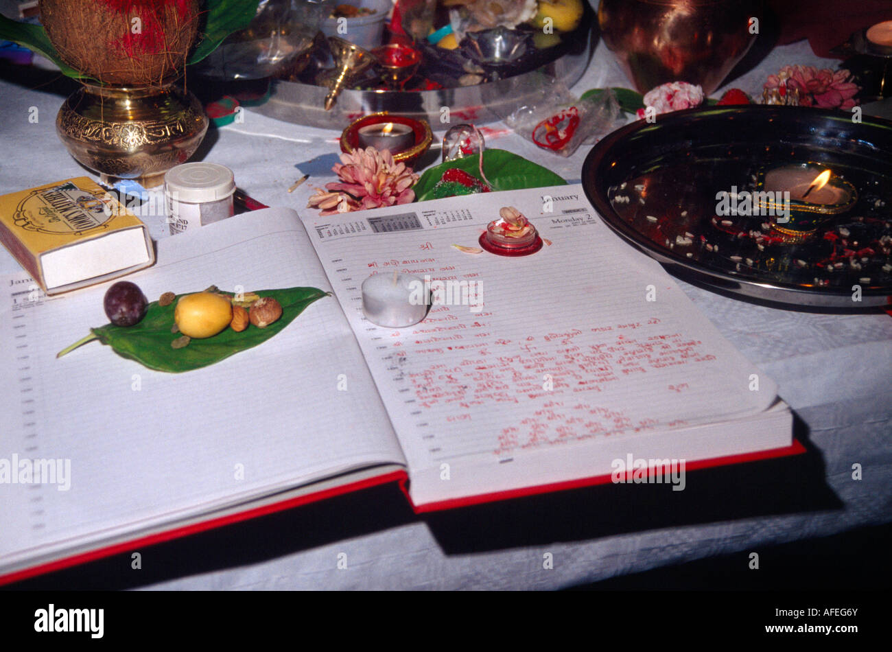 Red Chopdis (account Book) Performing Chopda Puja During Diwali Signifying the Start of the new Financial year in the Hindu Calendar Greenford Town Stock Photo